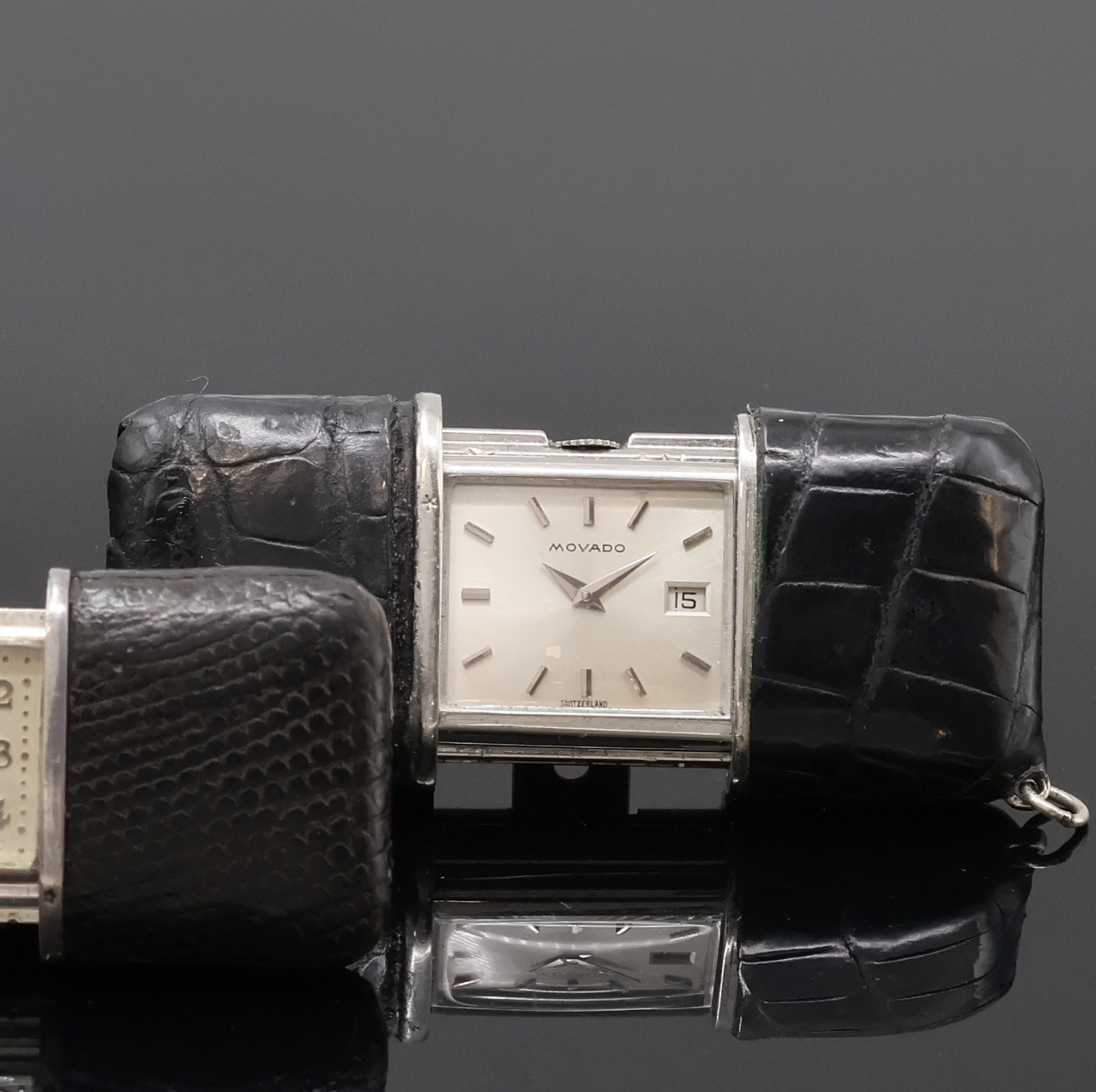 Detail b: 2 MOVADO Ermeto Schiebeührchen in Silber und Nickel, Schweiz um 1930 / 1960, Schiebeaufzug, Leder-bezogene Geh., silb. Zifferbl. m. silb. Zahlen / ...