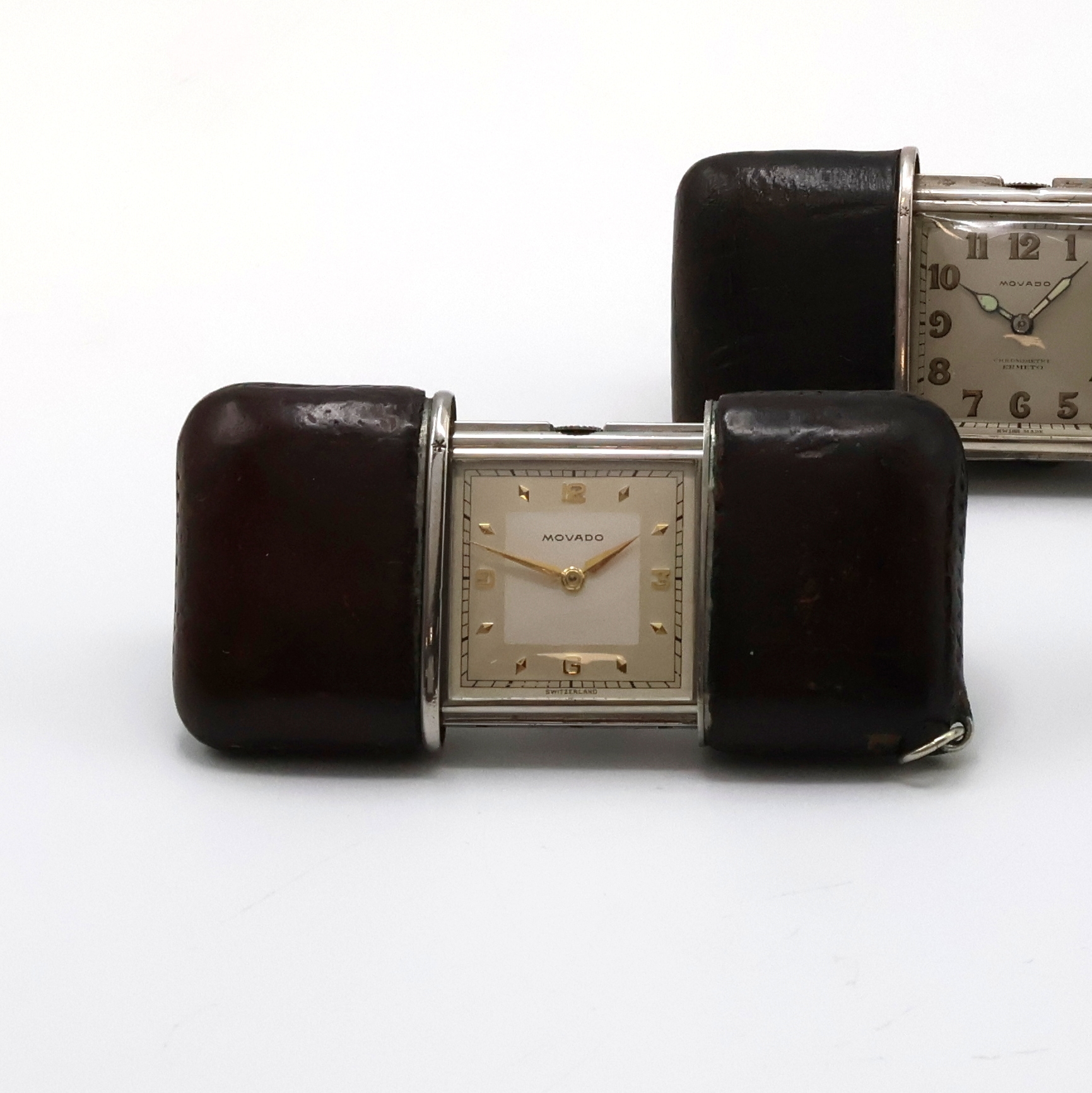 Detail a: 3 MOVADO Ermeto Schiebeührchen in Silber und Nickel, Schweiz um 1930 bis 1950, alle mit Schiebeaufzug, Leder-bezogene Geh., davon 2 in Silber, silb. ...