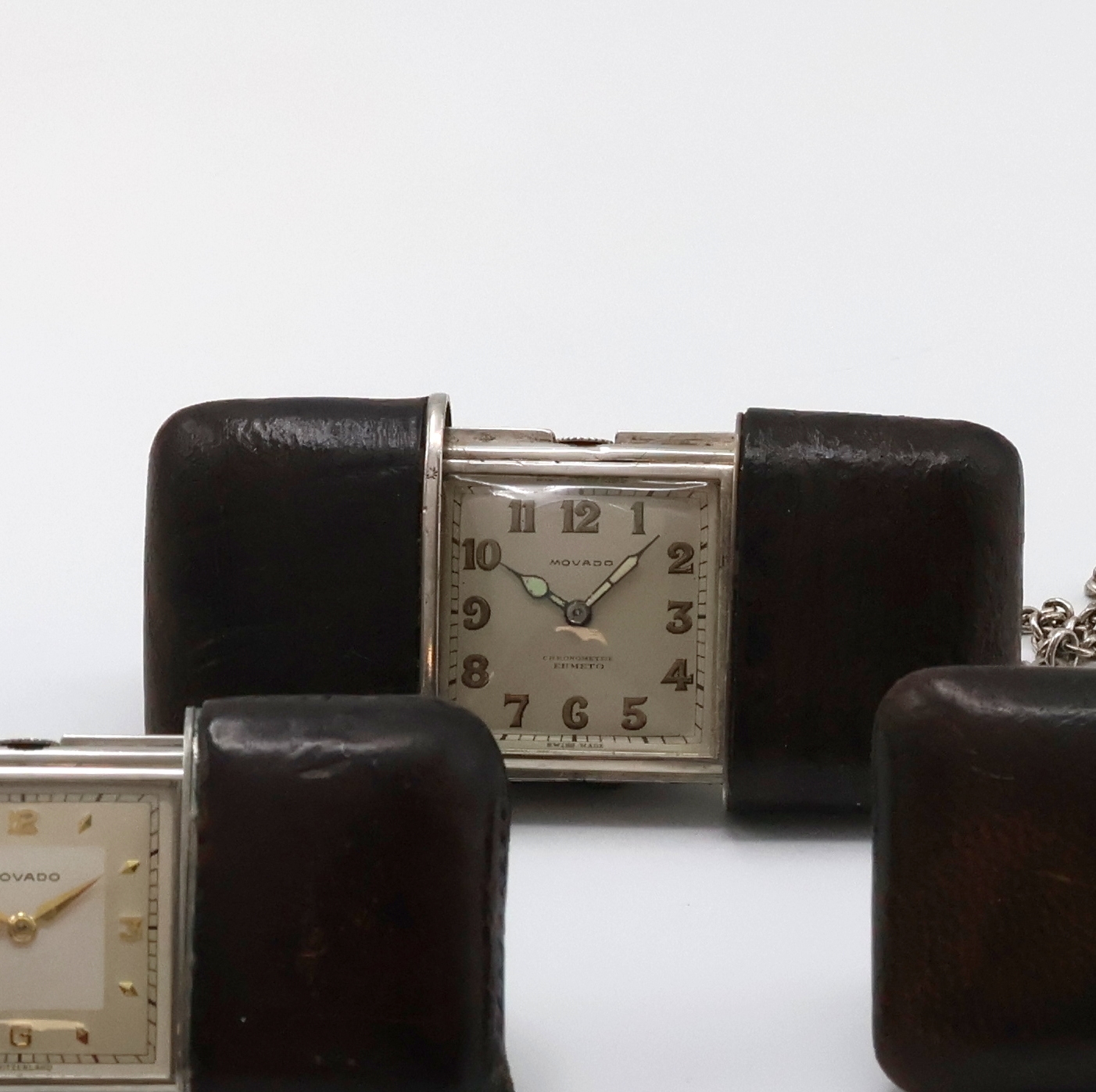Detail c: 3 MOVADO Ermeto Schiebeührchen in Silber und Nickel, Schweiz um 1930 bis 1950, alle mit Schiebeaufzug, Leder-bezogene Geh., davon 2 in Silber, silb. ...