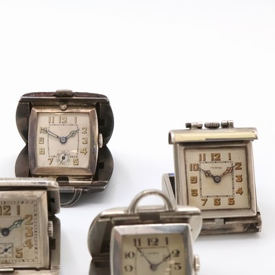 27059162b - 7 travel-watches in silver, Switzerland around 1930, manual winding, silvered dials, ...