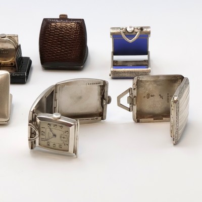 27059162d - 7 travel-watches in silver, Switzerland around 1930, manual winding, silvered dials, ...