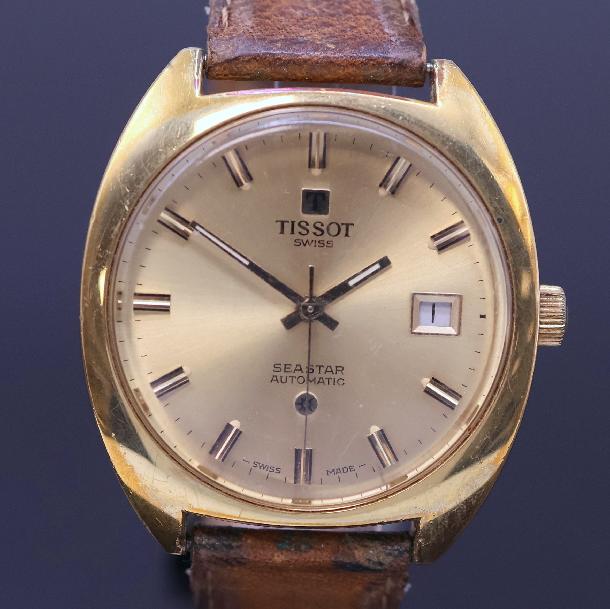 Detail b: TISSOT Seastar vergoldete Herrenarmbanduhr, Schweiz um 1970, Automatik, Boden verschr., champagnerfarb. Zifferbl. m. aufges. Std.- Ind., gold. ...