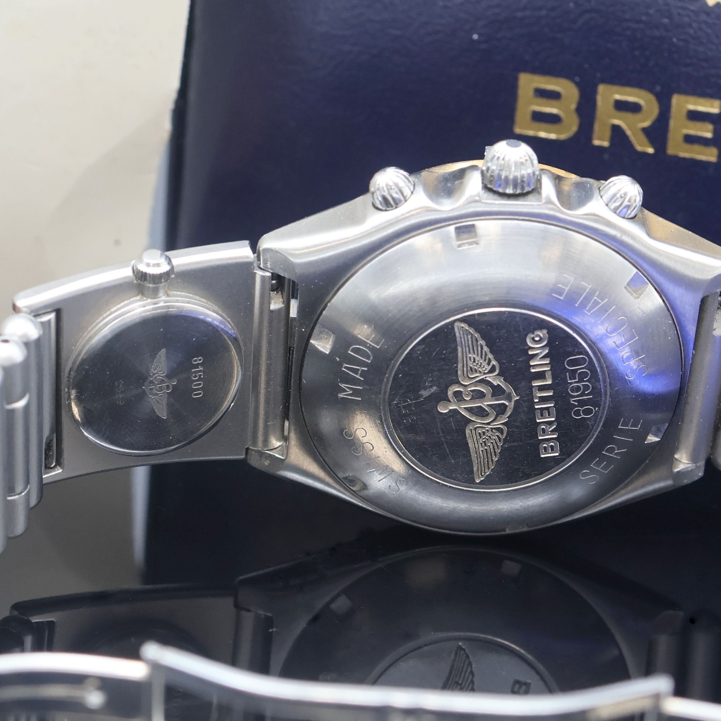 Detail e: BREITLING Herrenarmbanduhr Chronomat Referenz 81950, Schweiz um 1984, Automatik, Stahlgeh. inkl. Roleauxband m. UTC und dopp. Faltschl., zus. 2 ...