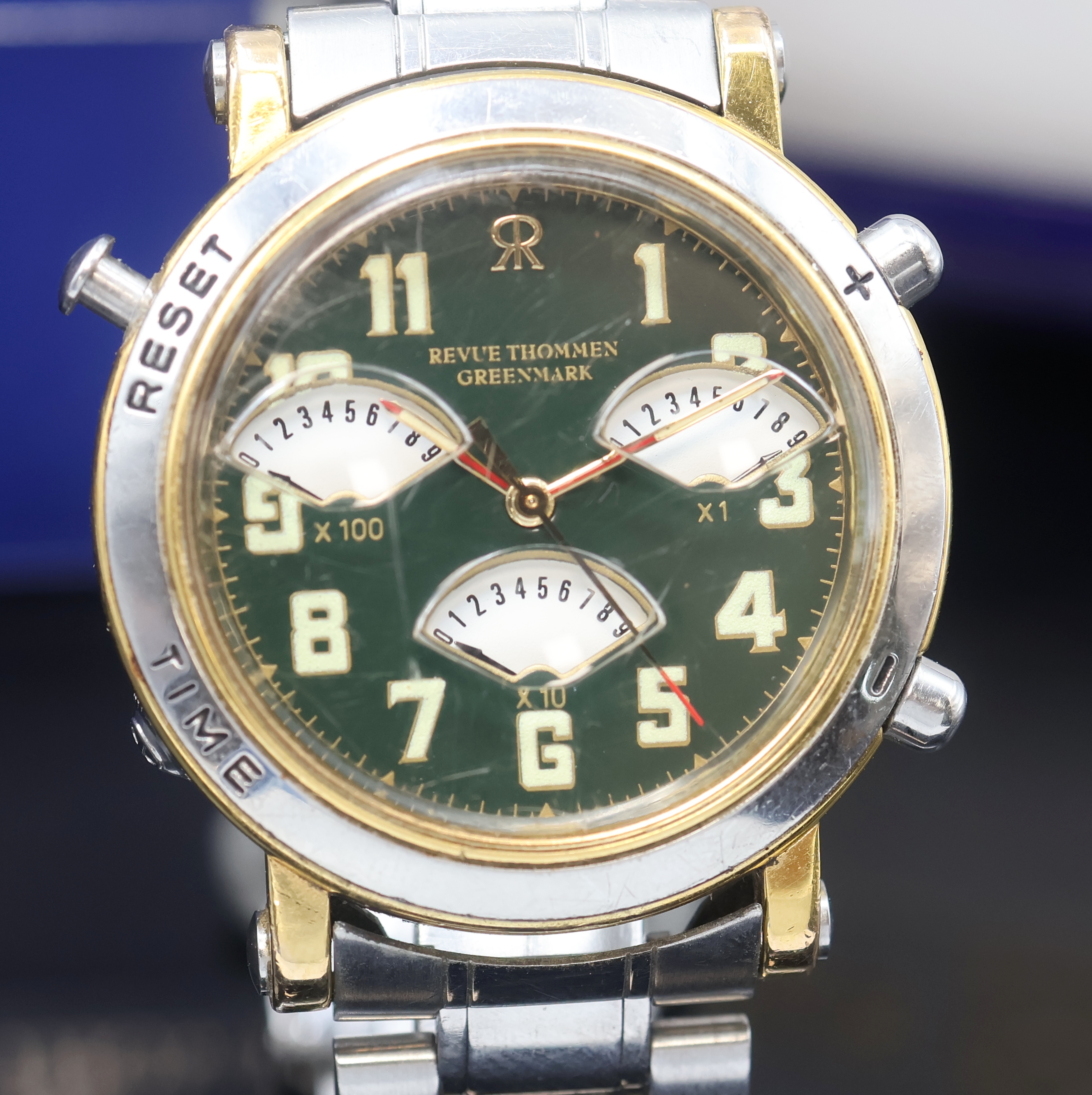 Detail a: REVUE THOMMEN Greenmark Armbanduhr mit Golf- Spielzähler, Schweiz um 1995, z. T. verg. Geh. inkl. orig. Gliederband m. Faltschl., Stahlboden und ...
