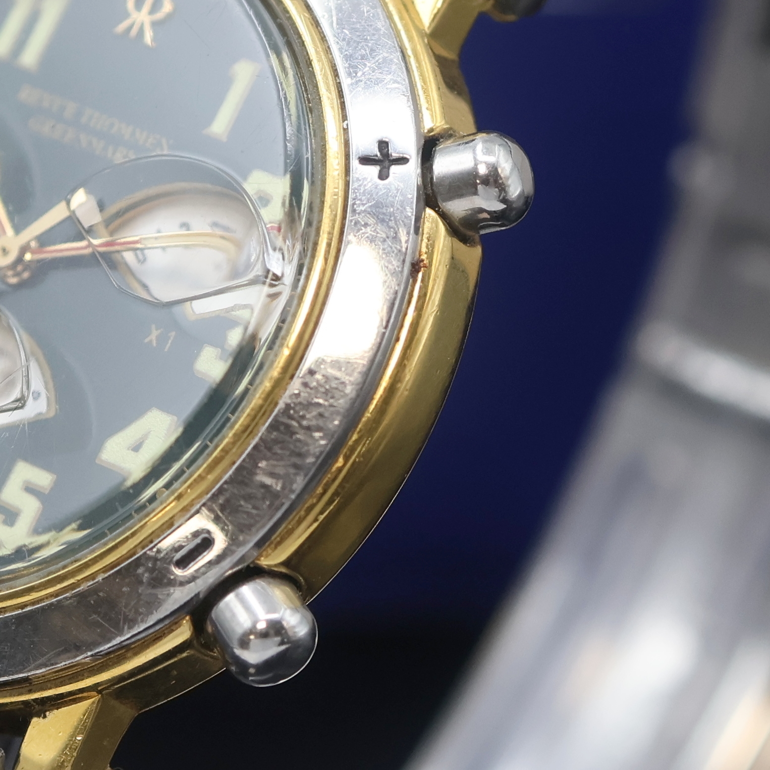 Detail b: REVUE THOMMEN Greenmark Armbanduhr mit Golf- Spielzähler, Schweiz um 1995, z. T. verg. Geh. inkl. orig. Gliederband m. Faltschl., Stahlboden und ...