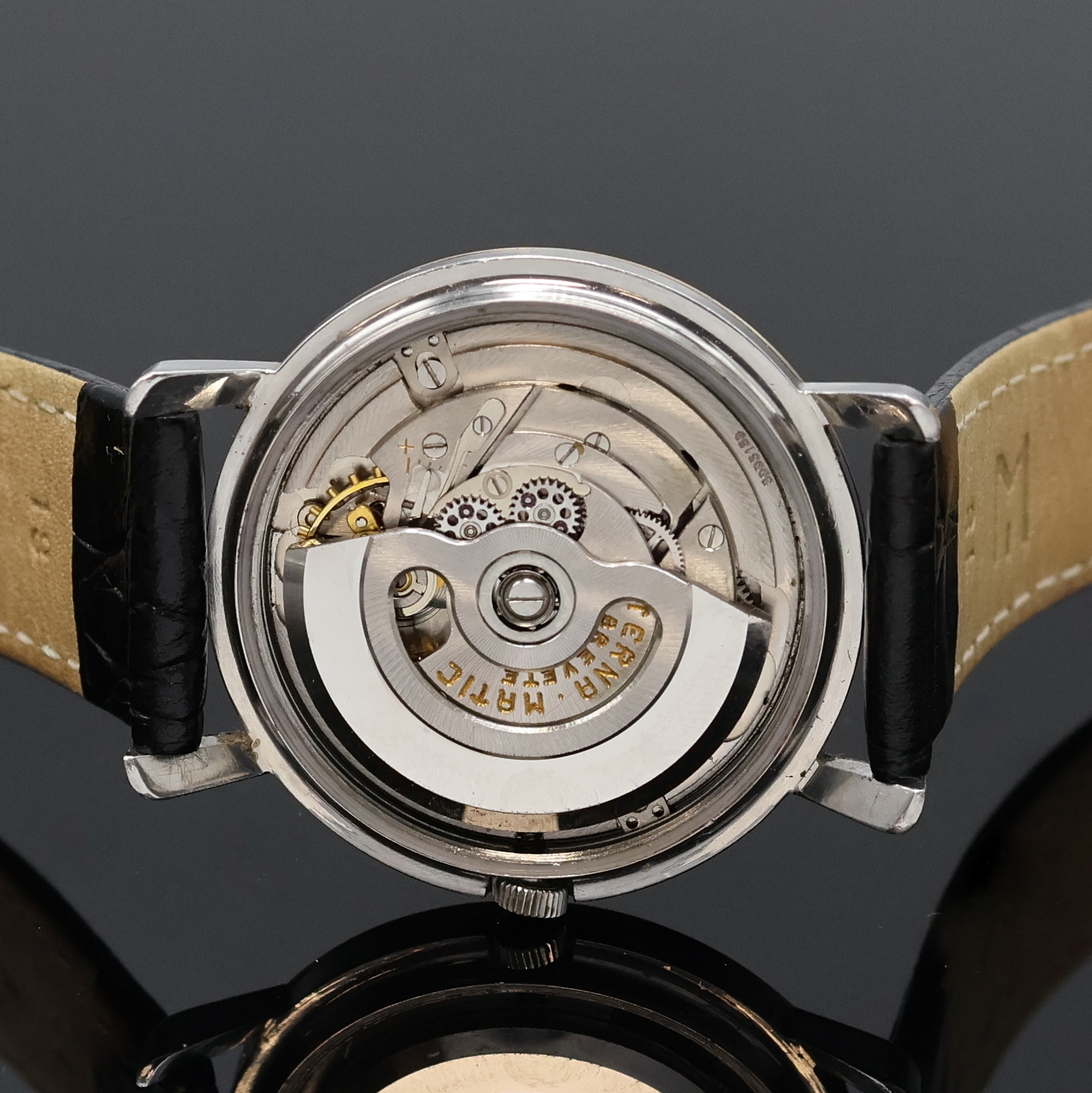 Detail e: ETERNA-MATIC Chronometer Armbanduhr, Schweiz um 1958, Automatik, Edelstahlgeh., Lünette wie Bandanst. mit Goldhaube, vers. Zifferblatt m. aufges. ...