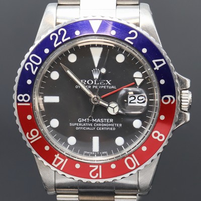 27061490a - ROLEX Oyster Perpetual GMT-Master Herrenarmbanduhr Referenz 1675, Schweiz um 1977, ...