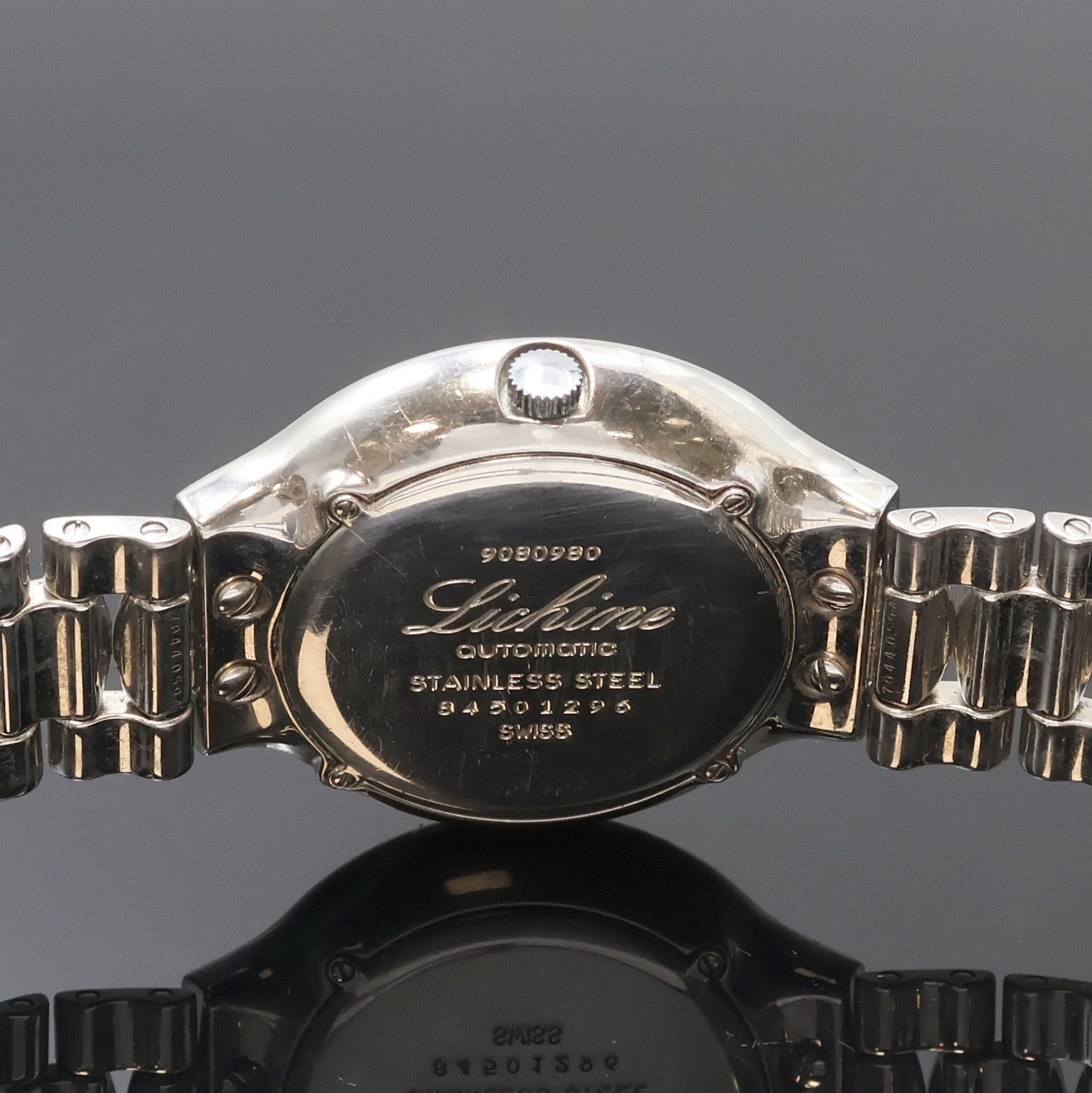 Detail e: EBEL Lichine Armbanduhr in Stahl Referenz 9080980, Schweiz um 1995, Automatik, orig. Gliederband m. Faltschl., Boden 4-fach verschr., silb. Zifferbl. ...