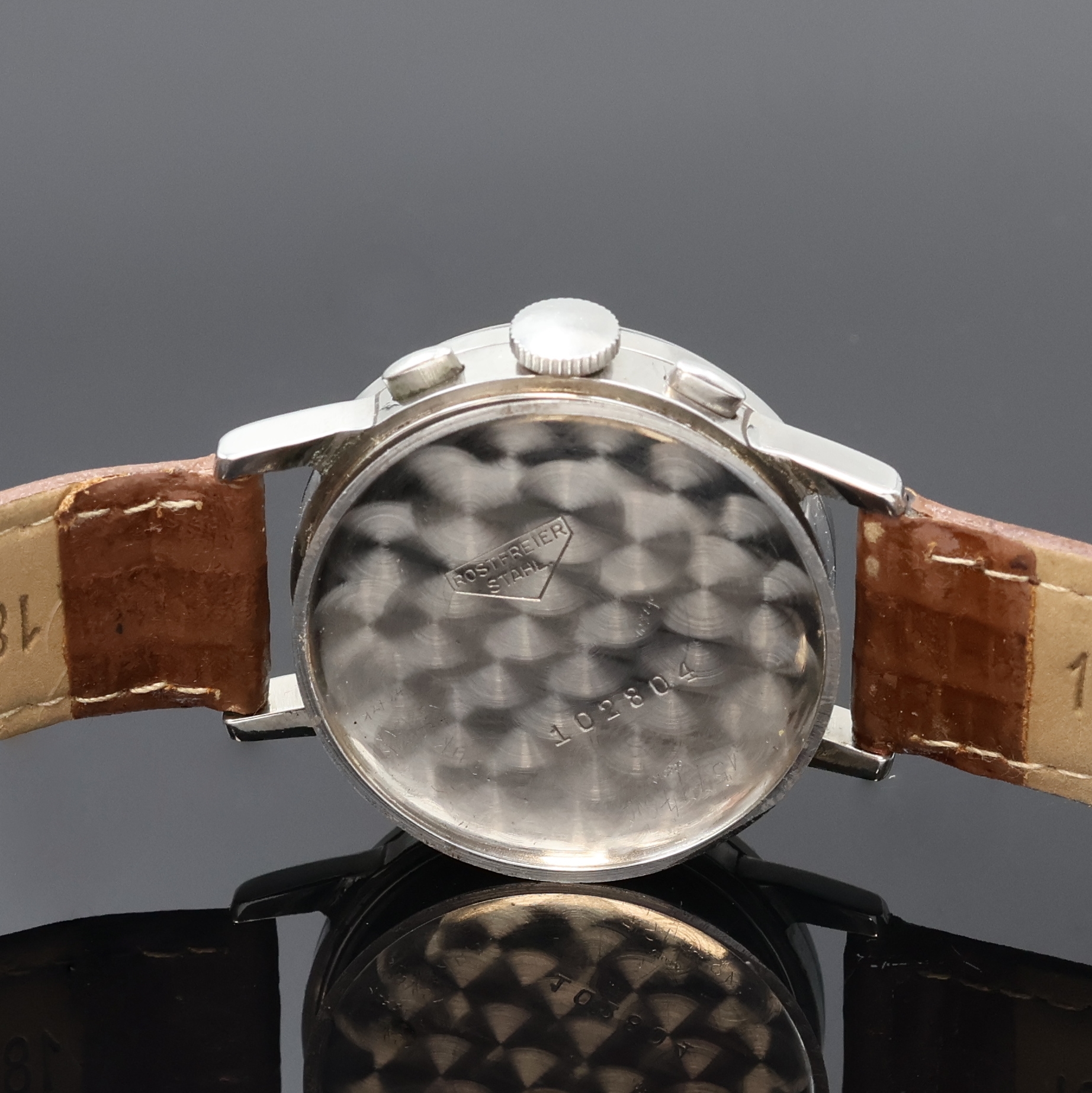 Detail e: GLYCINE Armbandchronograph mit Schaltrad in Stahl, Schweiz um 1940, Handaufzug, Boden u. Glasrand aufgedr., schön erhaltenes schwarzes ...
