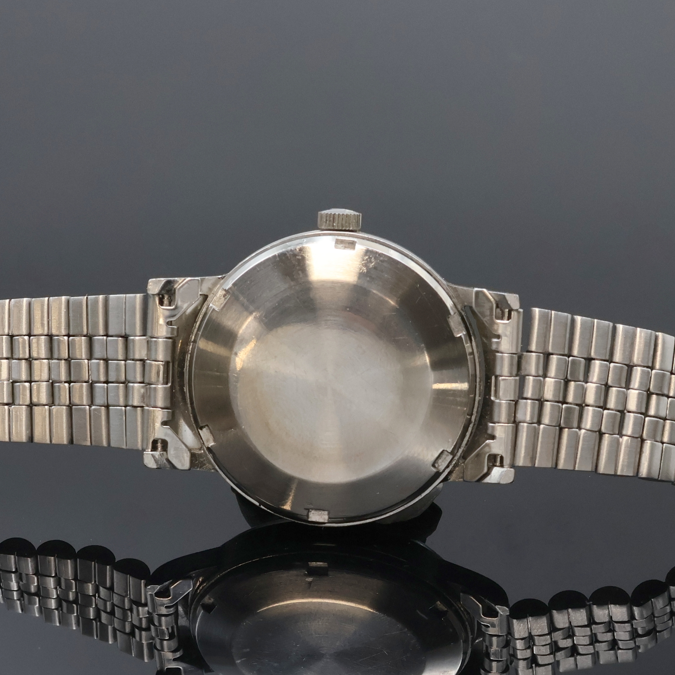 Detail c: IWC Herrenarmbanduhr in Stahl mit Kaliber 853, Schweiz um 1962, Automatik, neutr. Stahlband m. Faltschl., Boden verschr., silb. Zifferbl. rest., ...
