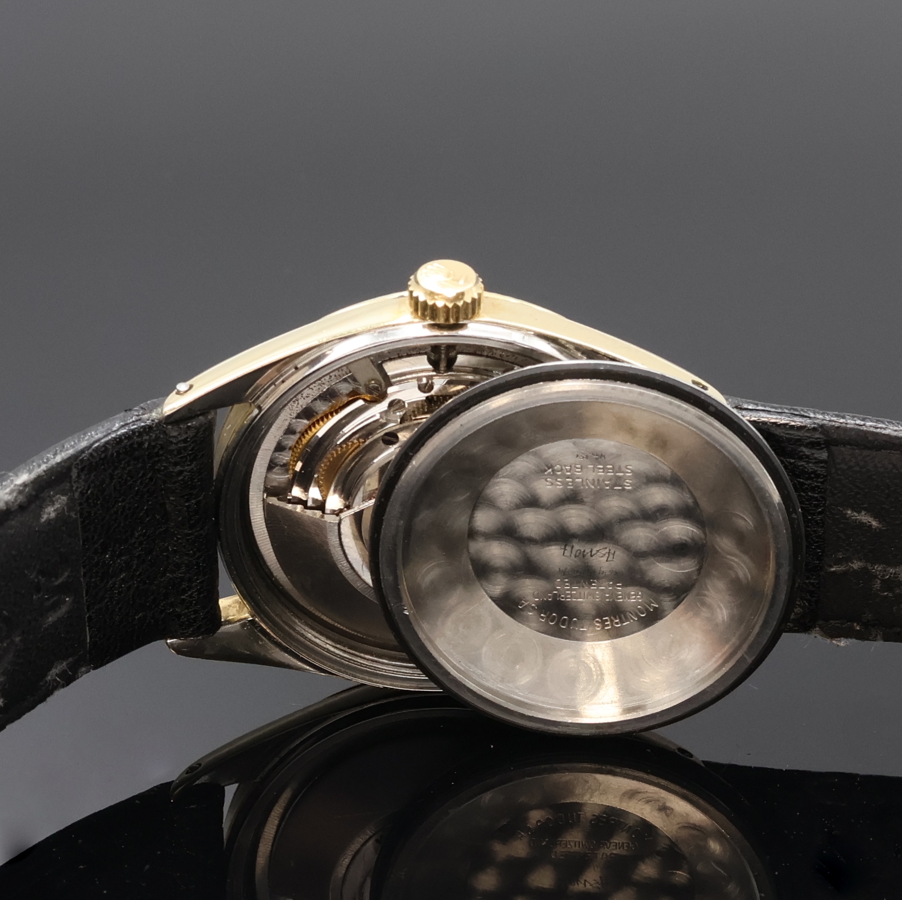Detail e: TUDOR Oysterdate Herrenarmbanduhr mit Goldhaube, Schweiz um 1960, Automatik, Boden u. Krone verschr., schön erhaltenes schwarzes Rose Zifferbl. m. ...