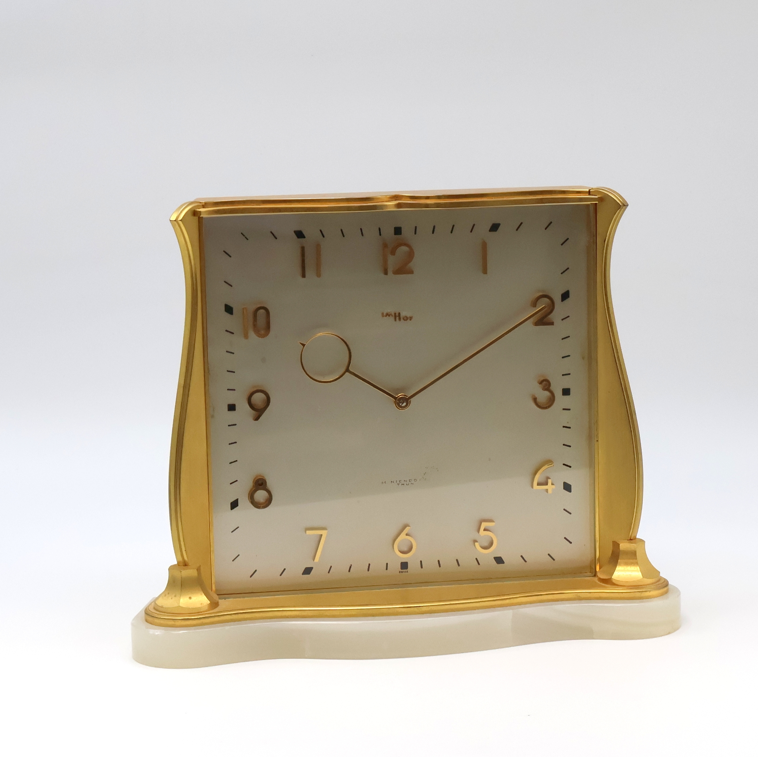 Detail a: IMHOF 2 hochwertige, vergoldete 8 Tage Tischuhren, Schweiz 1950-1960, 1x Steinsockel, vers. Zifferblätter m. gold. Std.-Ind. u. Zahlen, gold. ...