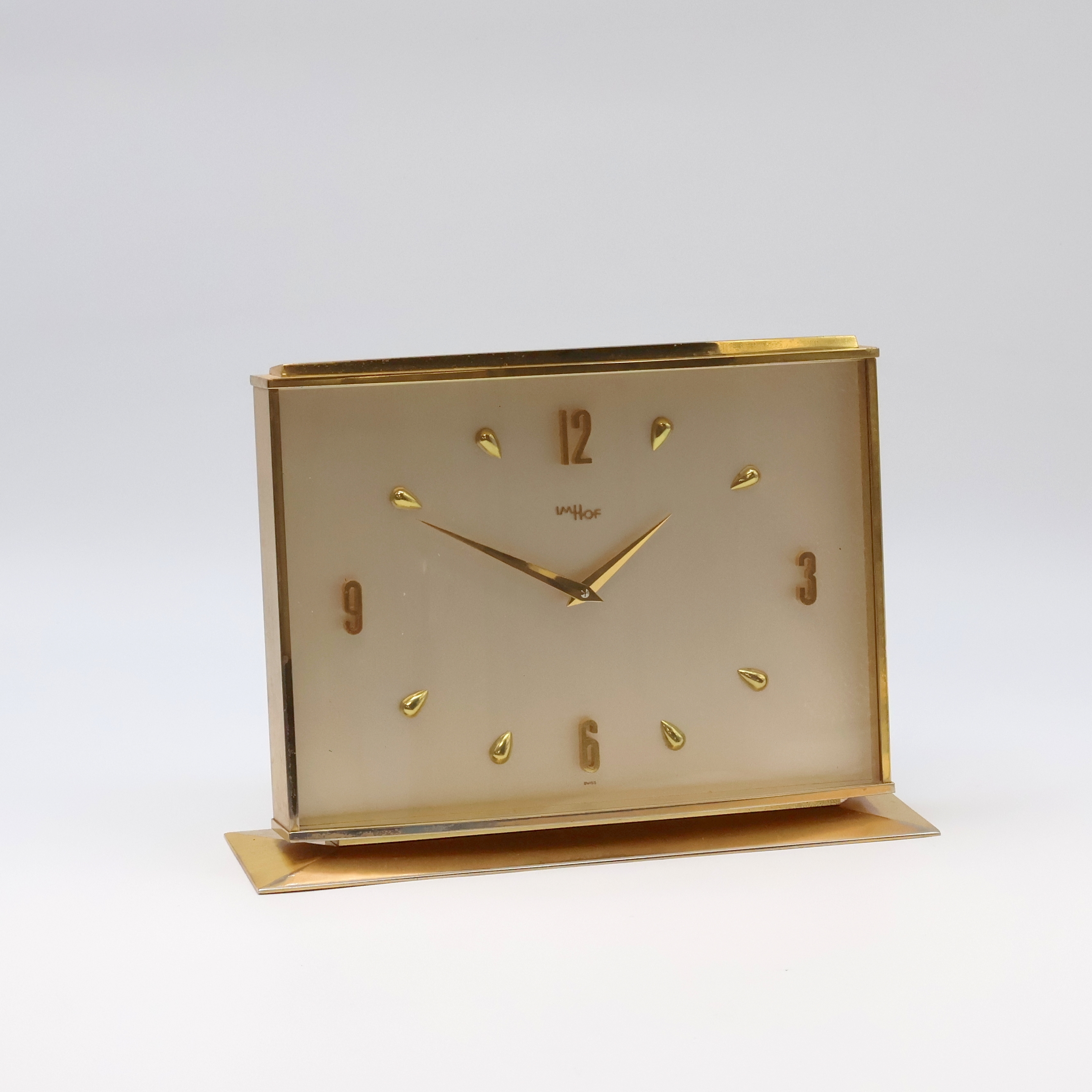 Detail e: IMHOF 2 hochwertige, vergoldete 8 Tage Tischuhren, Schweiz 1950-1960, 1x Steinsockel, vers. Zifferblätter m. gold. Std.-Ind. u. Zahlen, gold. ...