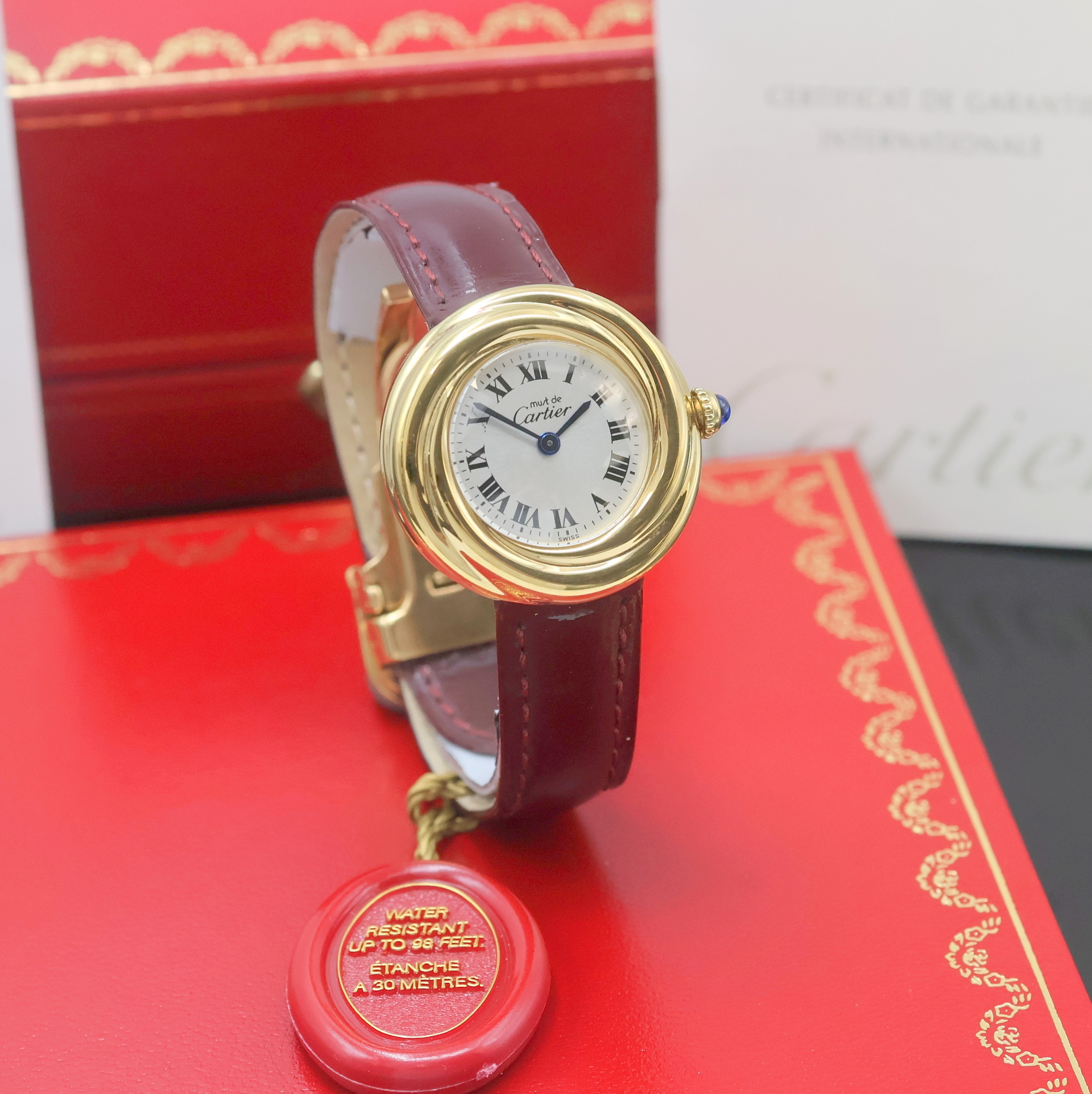 Detail b: CARTIER Trinity Vermeil Damenarmbanduhr Referenz 2735, quarz, verg. Sterlingsilbergeh. inkl. orig. Lederband m. orig. Faltschl., Boden 4-fach ...