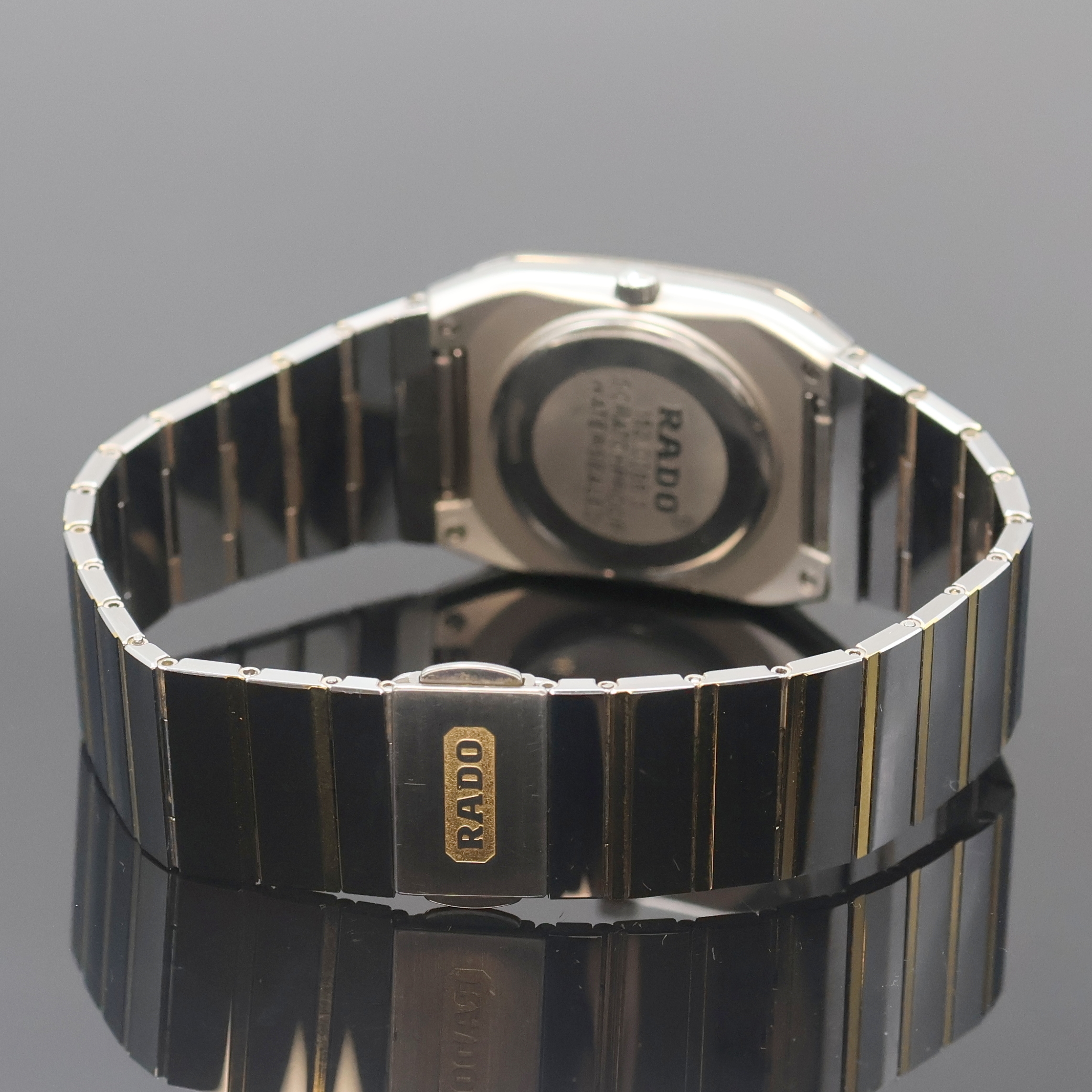 Detail b: RADO Diastar Armbanduhr Referenz 152.0366.3, Schweiz um 1995, quarz, Edelstahlgeh. inkl. Gliederband m. dopp. Faltschl., Boden aufgedr., graues ...