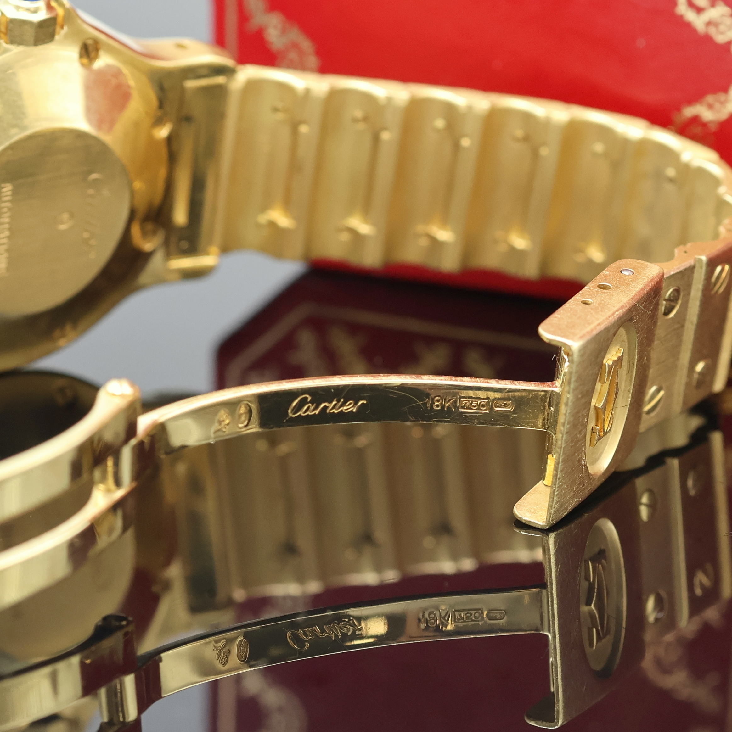 Detail e: CARTIER Santos Octagon Armbanduhr in GG 750/000, Automatik, massives Goldgeh. inkl. Gliederband m. Faltschl., oktagonale Lünette gegen Geh. 8-fach ...