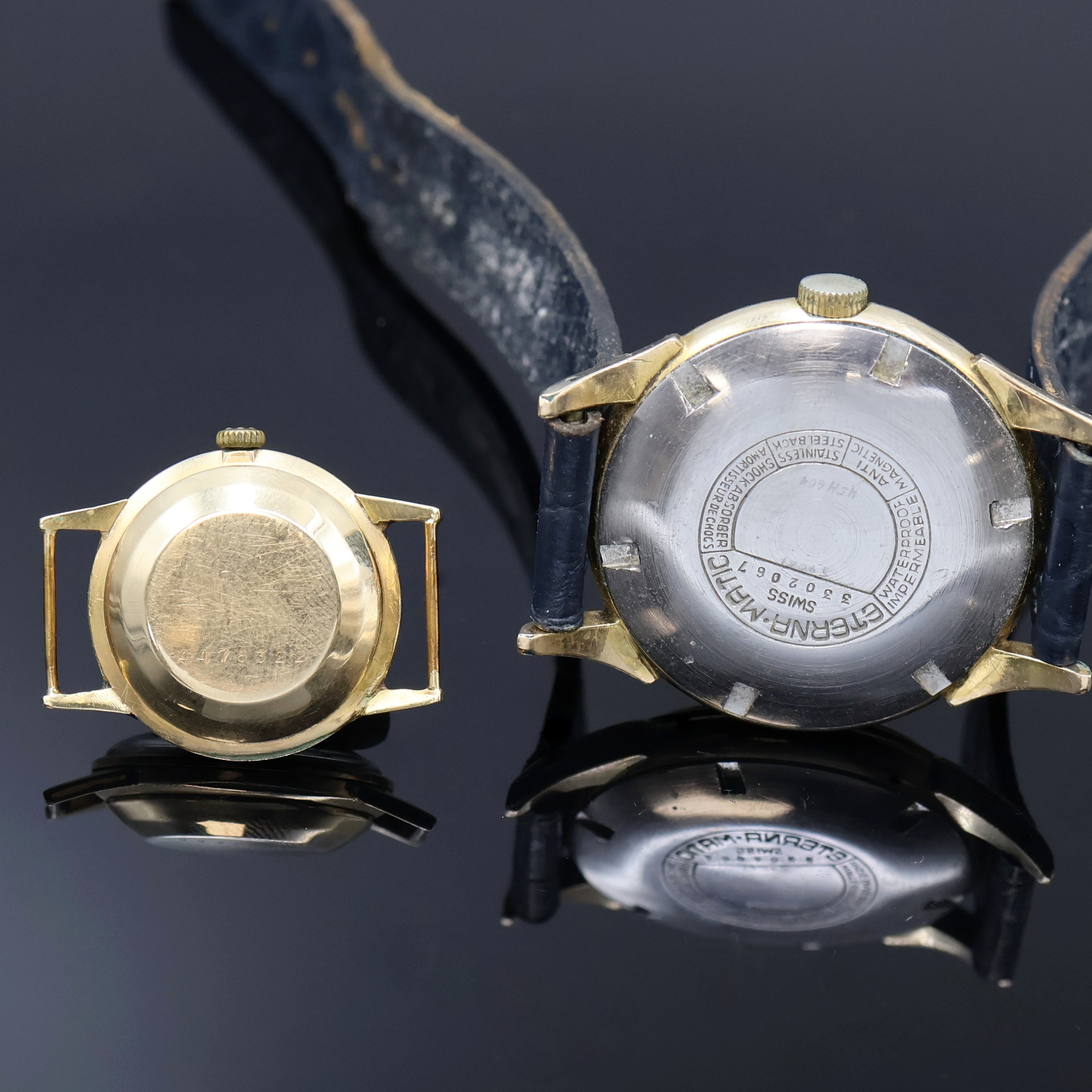 Detail e: ETERNA-MATIC 2 vergoldete Armbanduhren, Schweiz um 1950/1960, Automatik, 1x Stahlboden verschr., 1x verg. Boden aufgedr., silb. Blätter pat., gold. ...