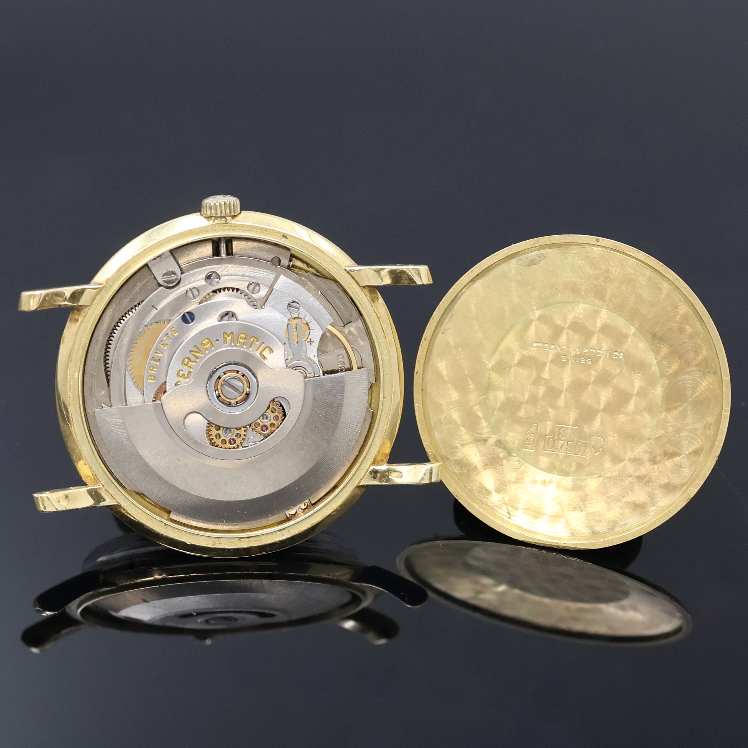 Detail d: ETERNA-MATIC Centenaire Armbanduhr in GG 750/000, Schweiz um 1965, Automatik, Boden aufgedr., silb. Zifferbl. pat., gold. Std.- Ind., gold. ...