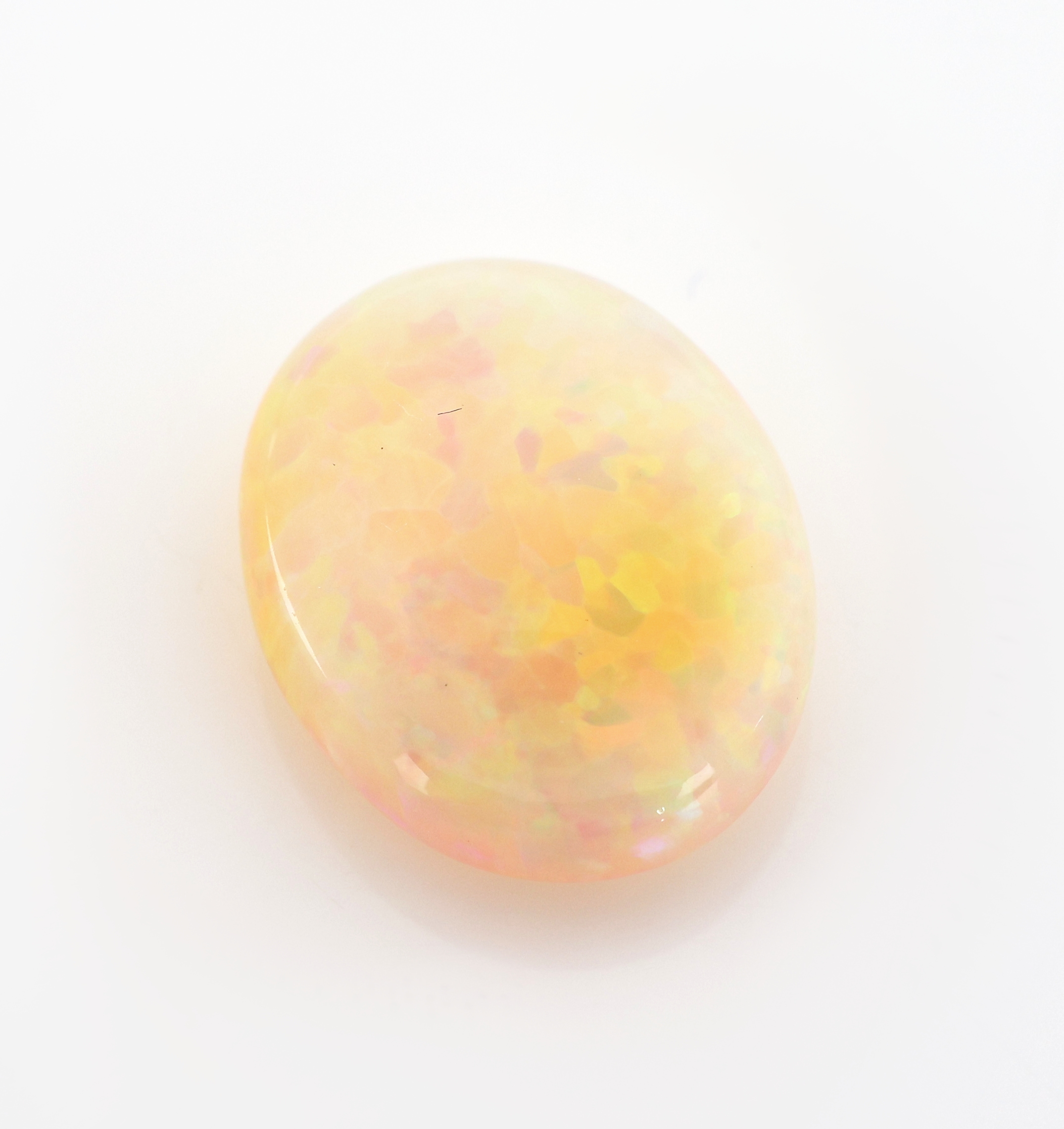 Detail b: Loser weißer Opal, 6.42 ct, Fundort: Äthiopien, Maße 15.9 x 12.5 x 6.2 mm, sehr schönes Farbspiel in Grün, Gelb und Orange