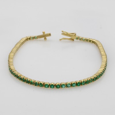 27070558a - Rivierarmband mit Smaragden, GG 750/000, fac. Smaragde zus. ca. 1.80 ct, Kastenschl. ...