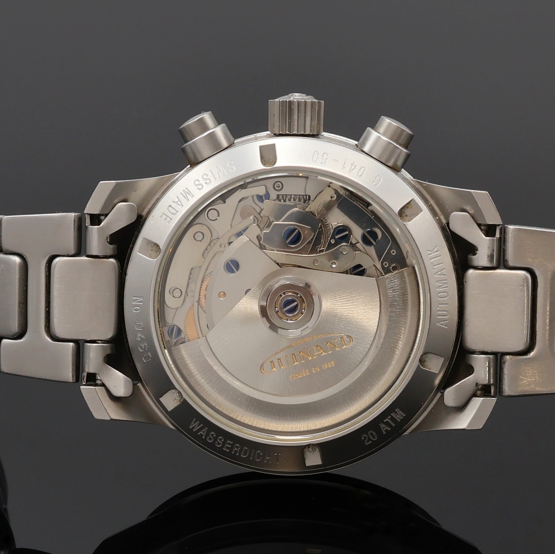 Detail d: GUINAND Armbandchronograph in Stahl/Stahlband, Schweiz um 1995, Automatik, beids. vergl. Geh., Boden u. Krone verschr., drehb. Tachymeter-Lünette, ...