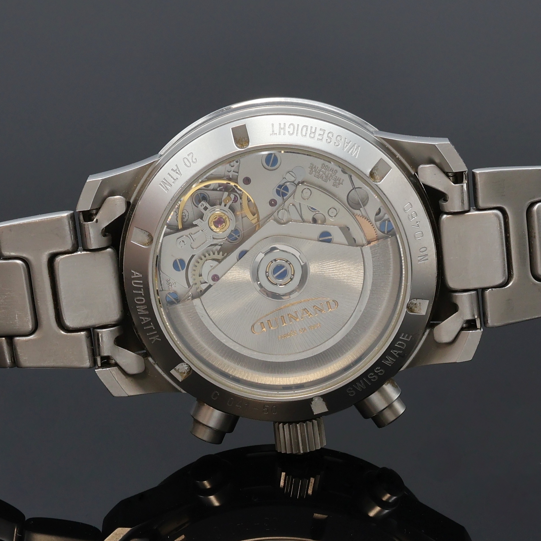 Detail e: GUINAND Armbandchronograph in Stahl/Stahlband, Schweiz um 1995, Automatik, beids. vergl. Geh., Boden u. Krone verschr., drehb. Tachymeter-Lünette, ...