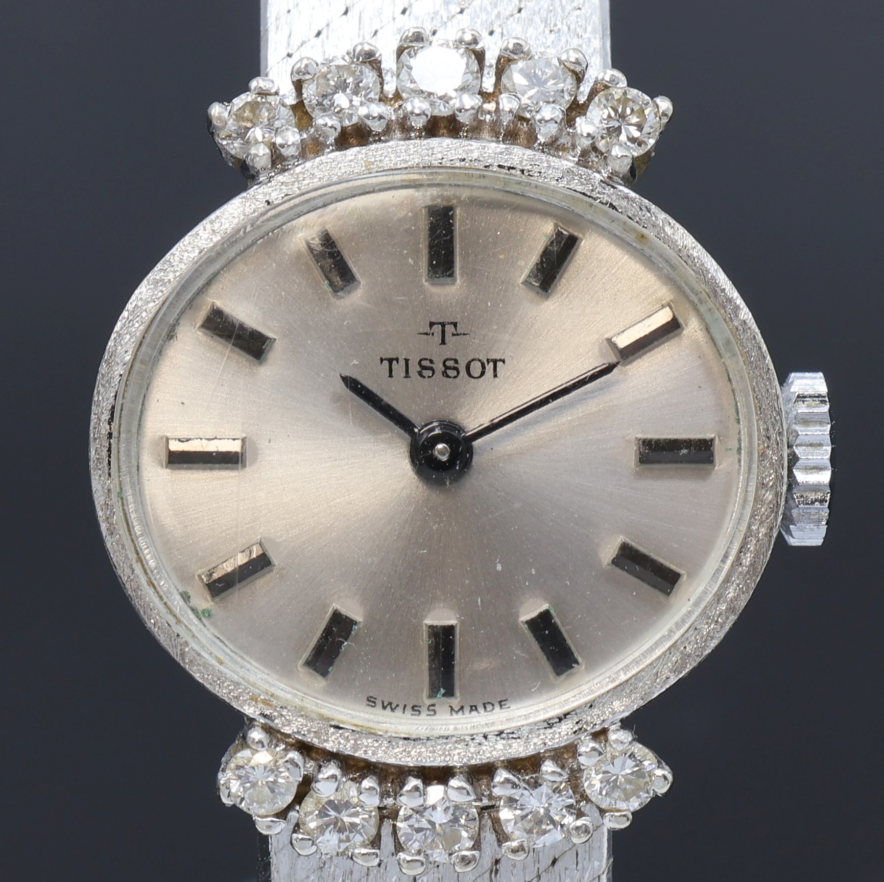 Detail a: TISSOT Damenarmbanduhr in WG 585/000 mit Diamanten, Schweiz um 1965, Handaufzug, Boden aufgedr., Geh. am Milanaiseband m. 10 Diamanten bes., silb. ...