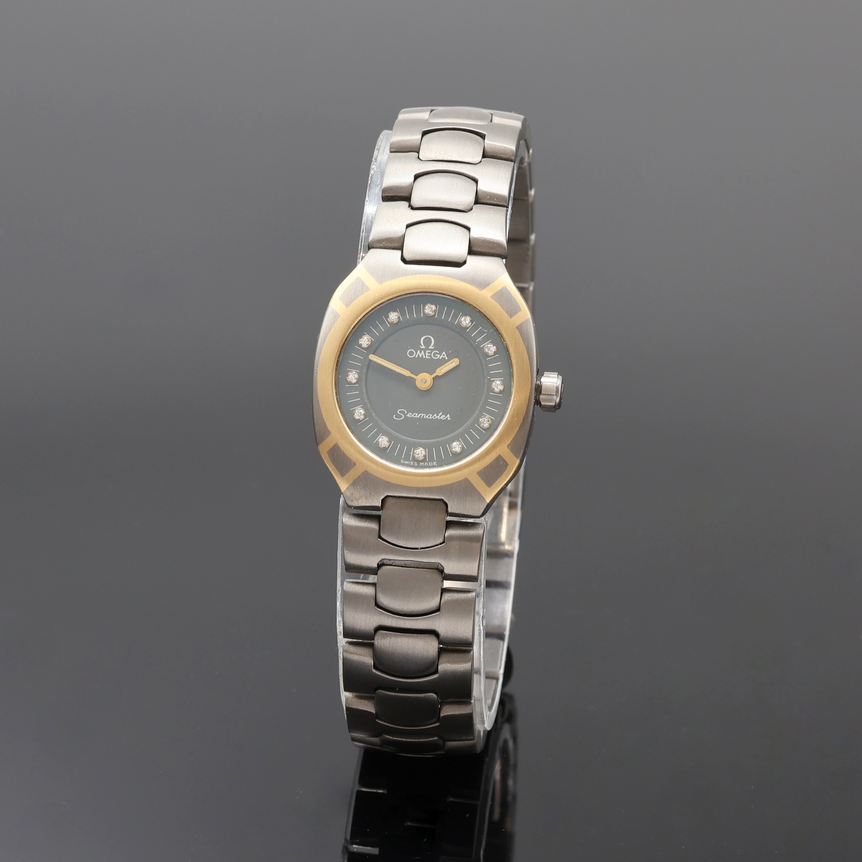 Image 27076701 - OMEGA Damenarmbanduhr Polaris Referenz 7951031, quarz, Titangeh. Gold-Intarsiert, orig. ...