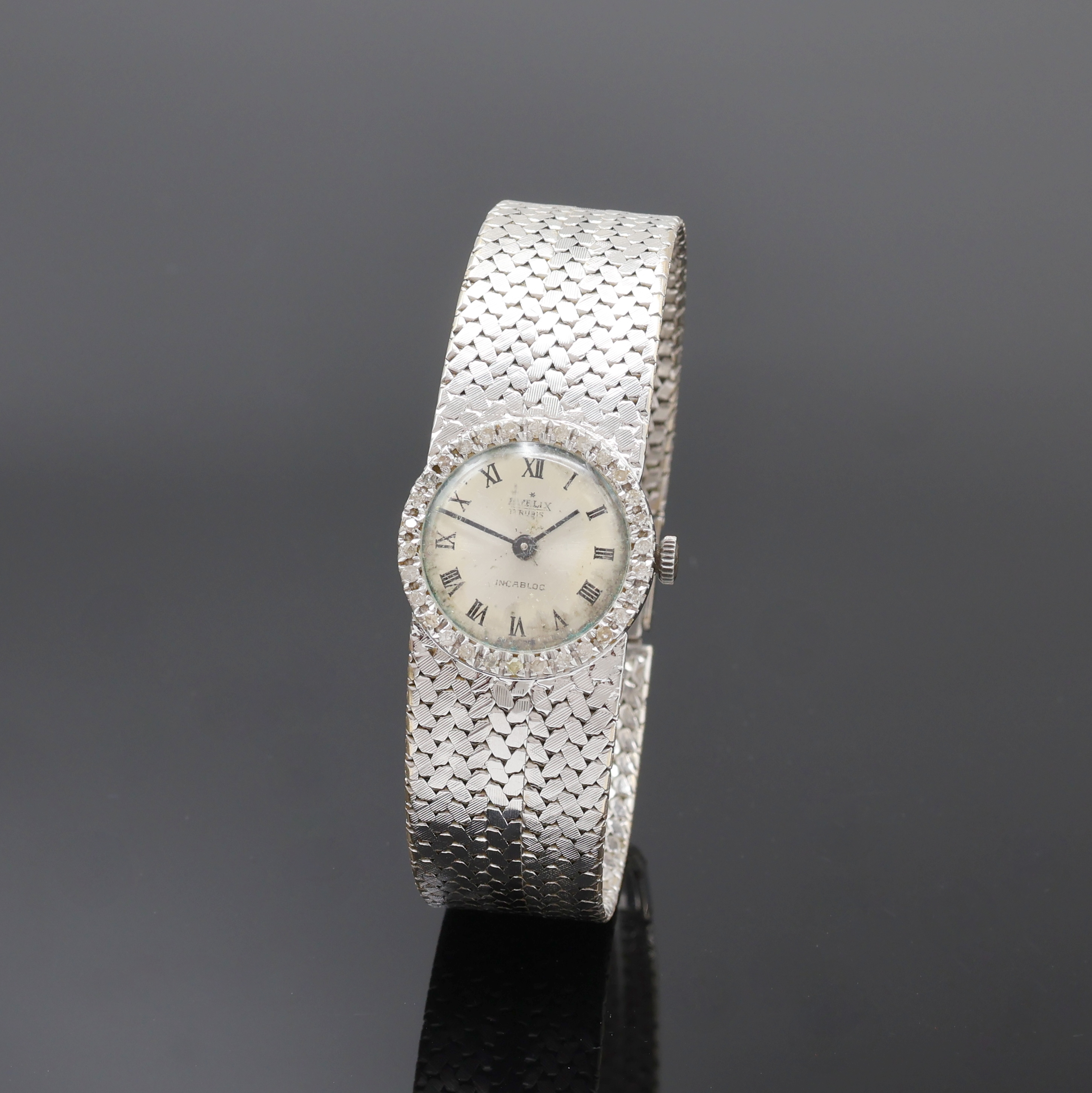 Image 27077588 - EVELIX Damenarmbanduhr in WG 750/000 mit Diamantlünette, Handaufzug, Schweiz 1960er ...
