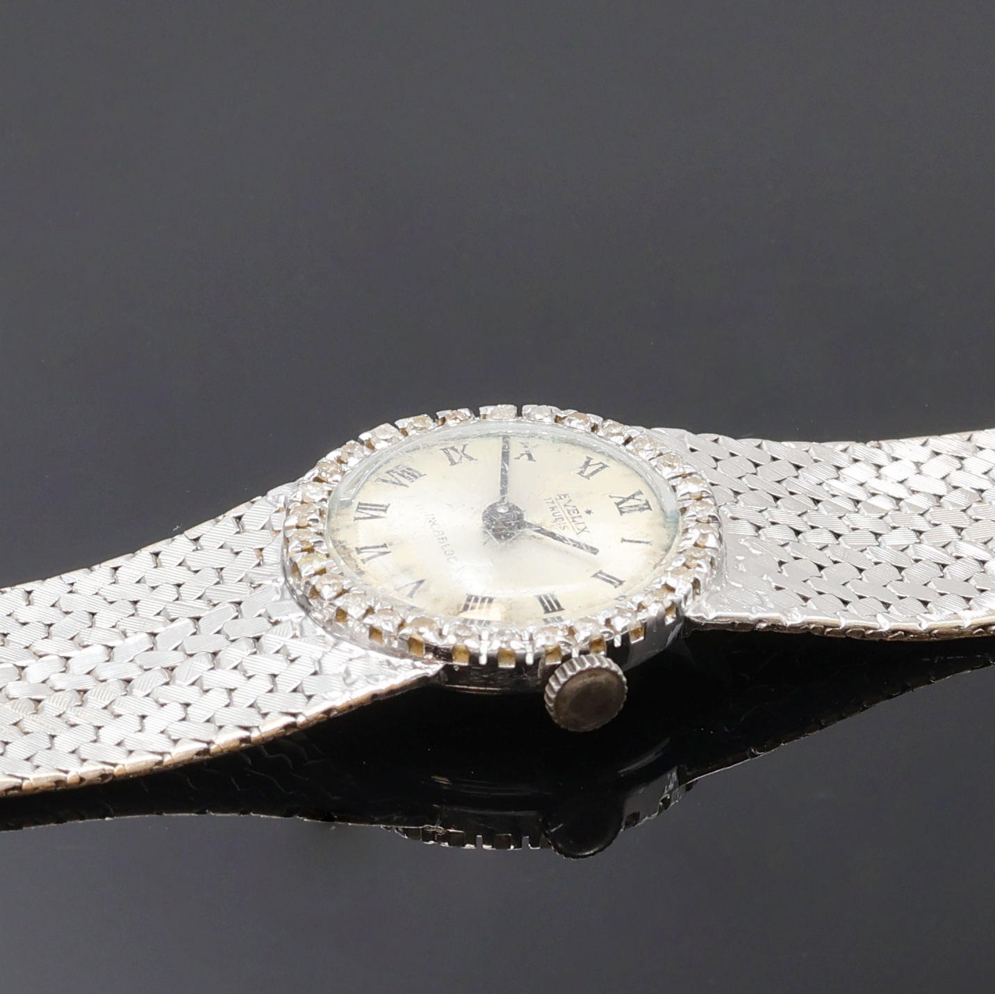 Detail c: EVELIX Damenarmbanduhr in WG 750/000 mit Diamantlünette, Handaufzug, Schweiz 1960er Jahre, Boden aufgedr., silb. Zifferbl. altersbed. fl./pat., ...