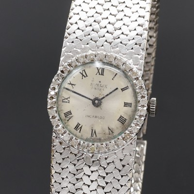 27077588a - EVELIX Damenarmbanduhr in WG 750/000 mit Diamantlünette, Handaufzug, Schweiz 1960er ...