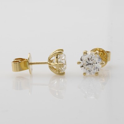 27079564a - Paar Ohrstecker mit Brillantsolitären, WG 750/000, 2 Brill. in Krappenfassung zus. 2.01 ...