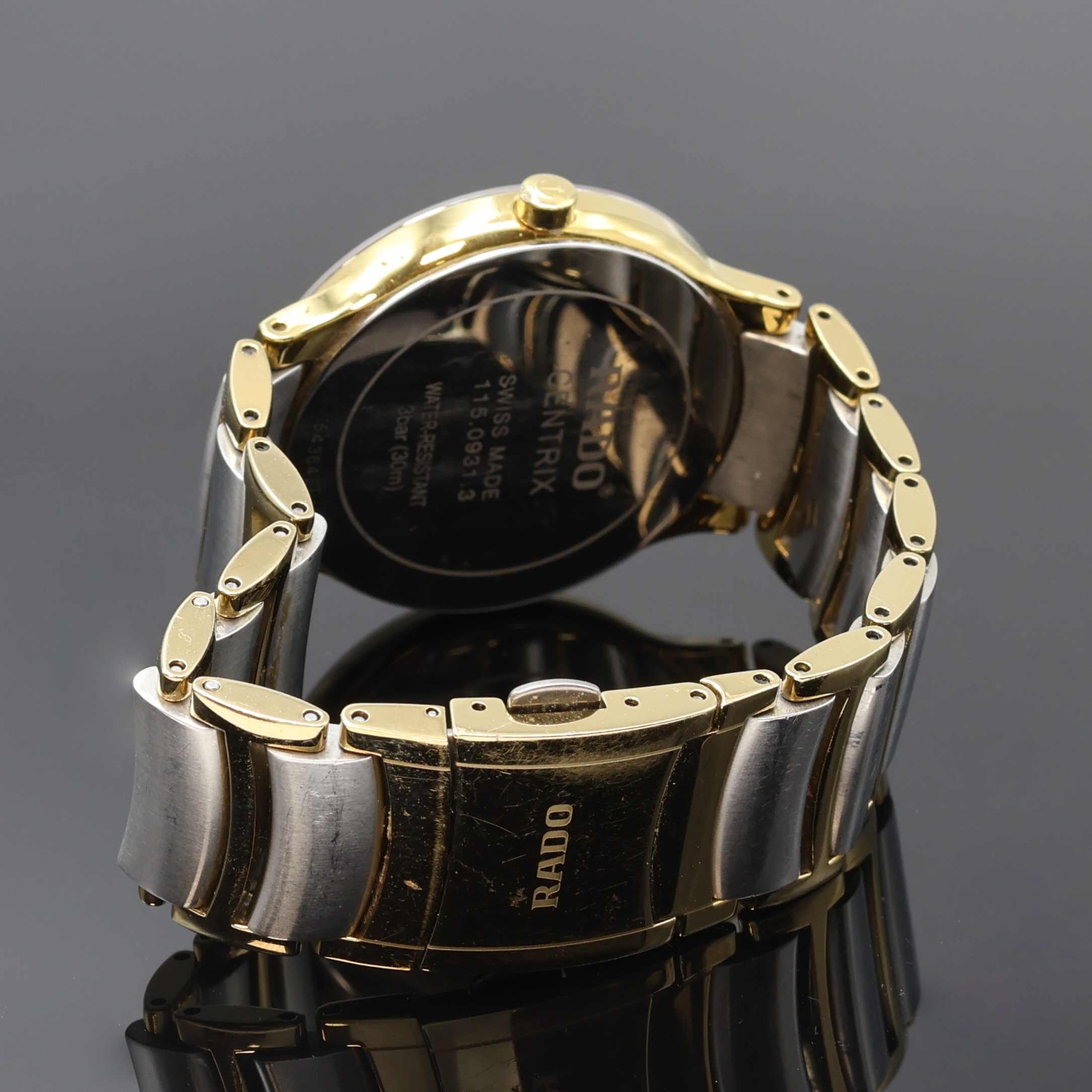 Detail b: RADO Centrix Herrenarmbanduhr Referenz 115.0931.1, Schweiz um 2010, quarz, verg. Geh. inkl. orig. Gliederband m. dopp. Titan- Faltschl., Stahlboden ...