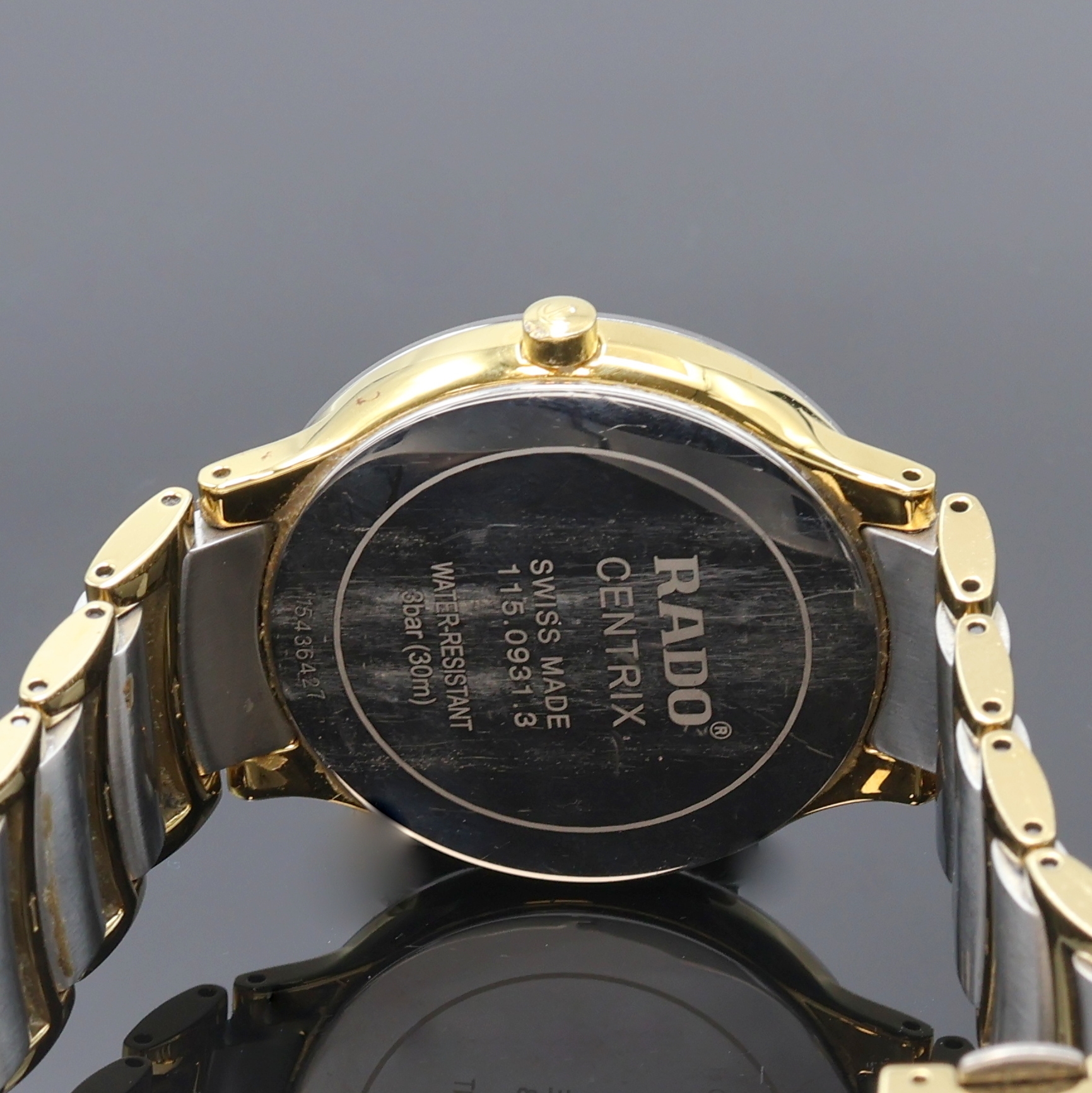 Detail d: RADO Centrix Herrenarmbanduhr Referenz 115.0931.1, Schweiz um 2010, quarz, verg. Geh. inkl. orig. Gliederband m. dopp. Titan- Faltschl., Stahlboden ...