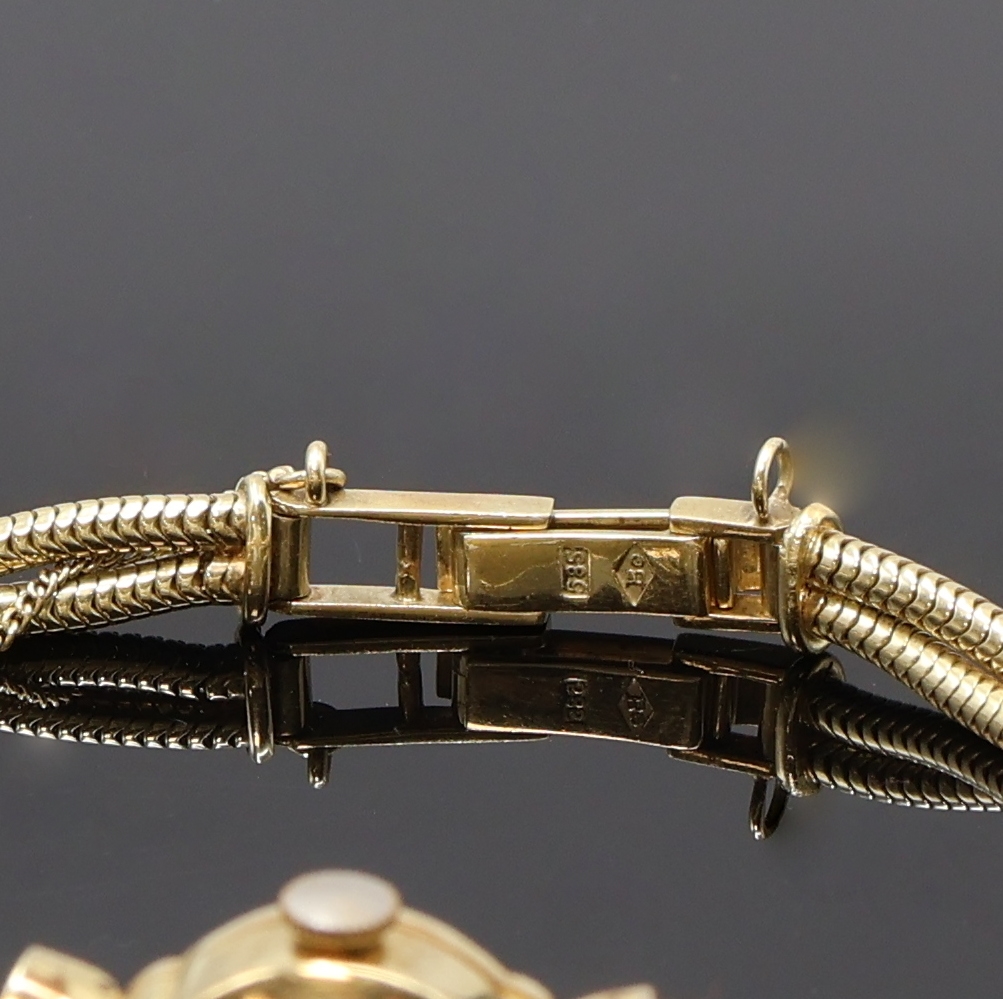 Detail b: BRAUN Damenarmbanduhr in GG 585/000, Schweiz um 1955, Handaufzug, 2-teil. Geh., Scharnierboden, silb. Zifferbl. pat., gold. Indizes und Zeiger, ...