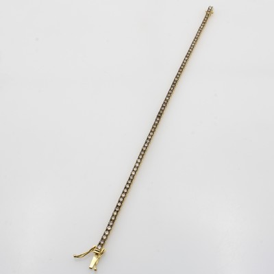 Image Tennisarmband mit Diamanten, GG 750/000, 69 Diam. zus. ca. 3.66 ct Braun/vs, Kastenschl. ...