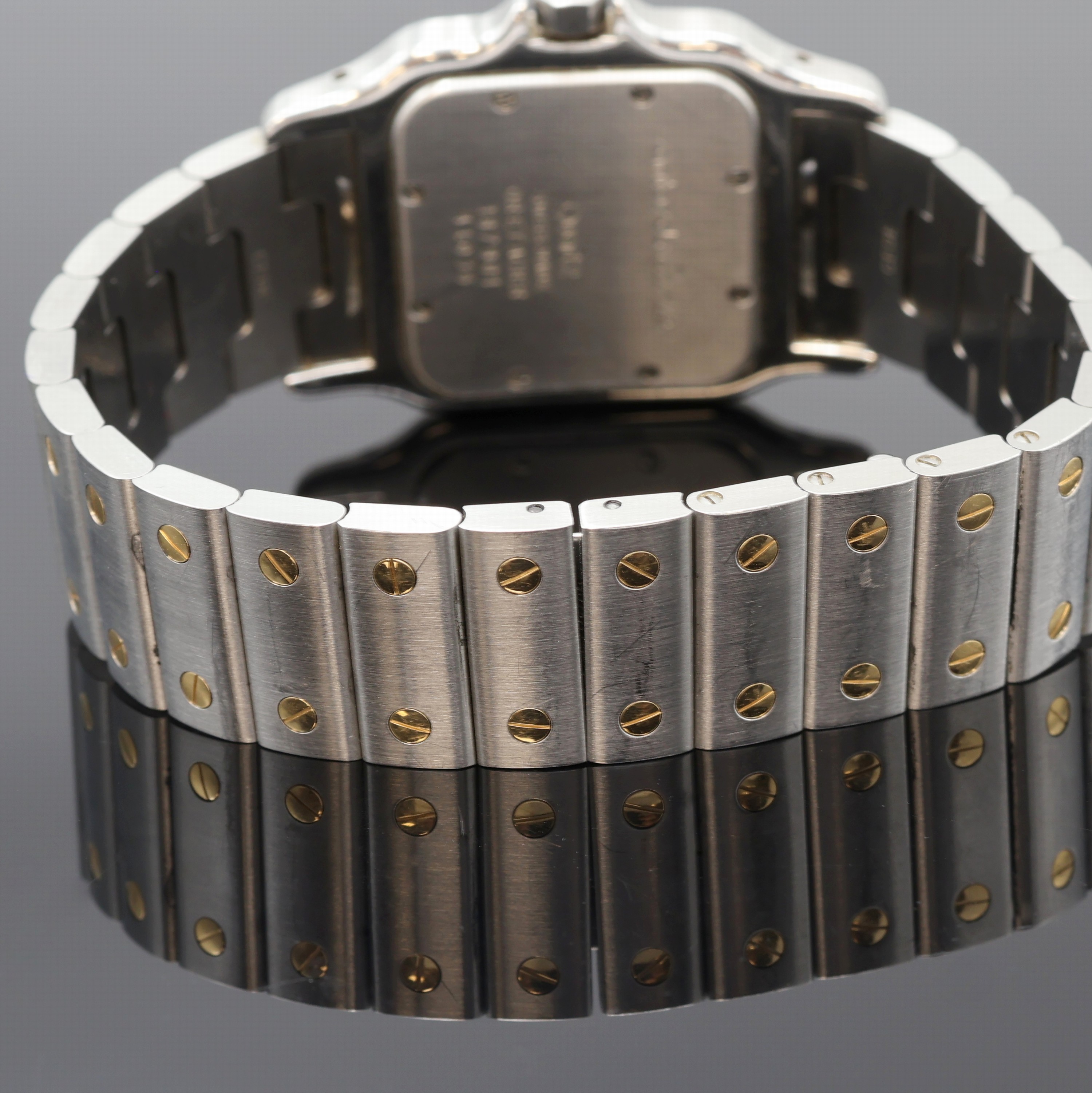 Detail d: CARTIER Santos Armbanduhr Referenz 187901, Schweiz um 1995, quarz, Edelstahl/Gold komb. inkl. orig. Gliederband m. dopp. Faltschl., Schmuckkrone, ...
