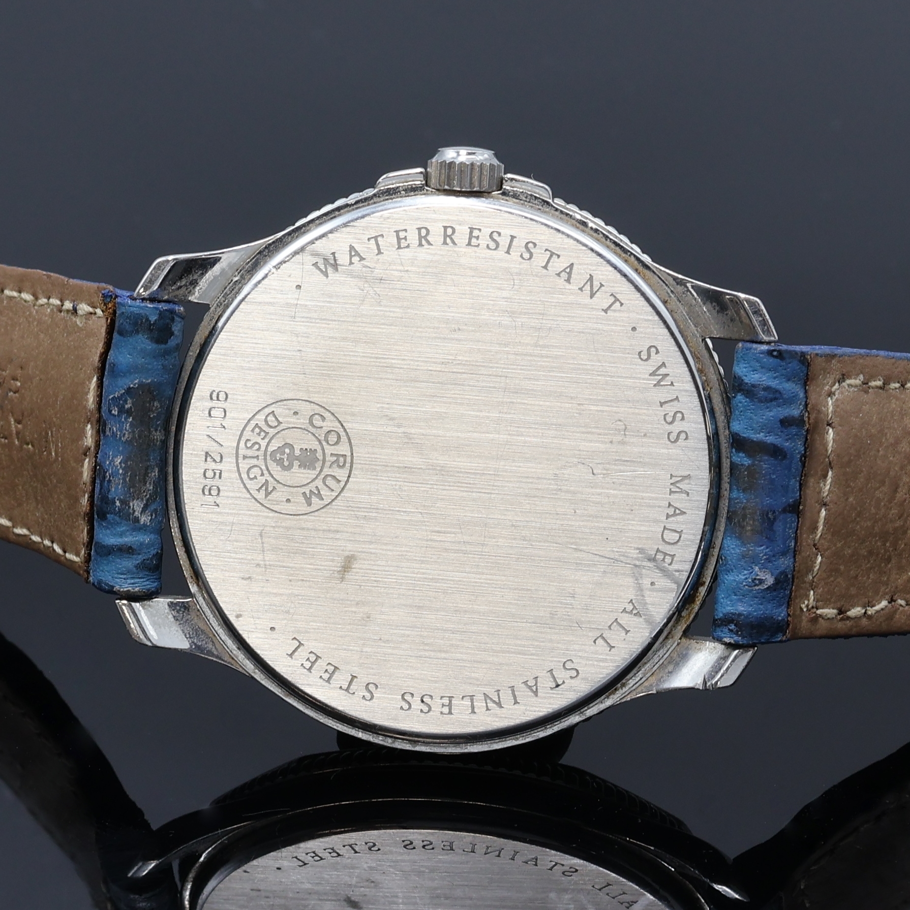 Detail e: CORUM Memotime Save the Sea Armbanduhr, Schweiz um 1990, quarz, Edelstahlgeh. inkl. Lederband m. orig. Dornschl., Boden aufgedr., Lünette m. ...