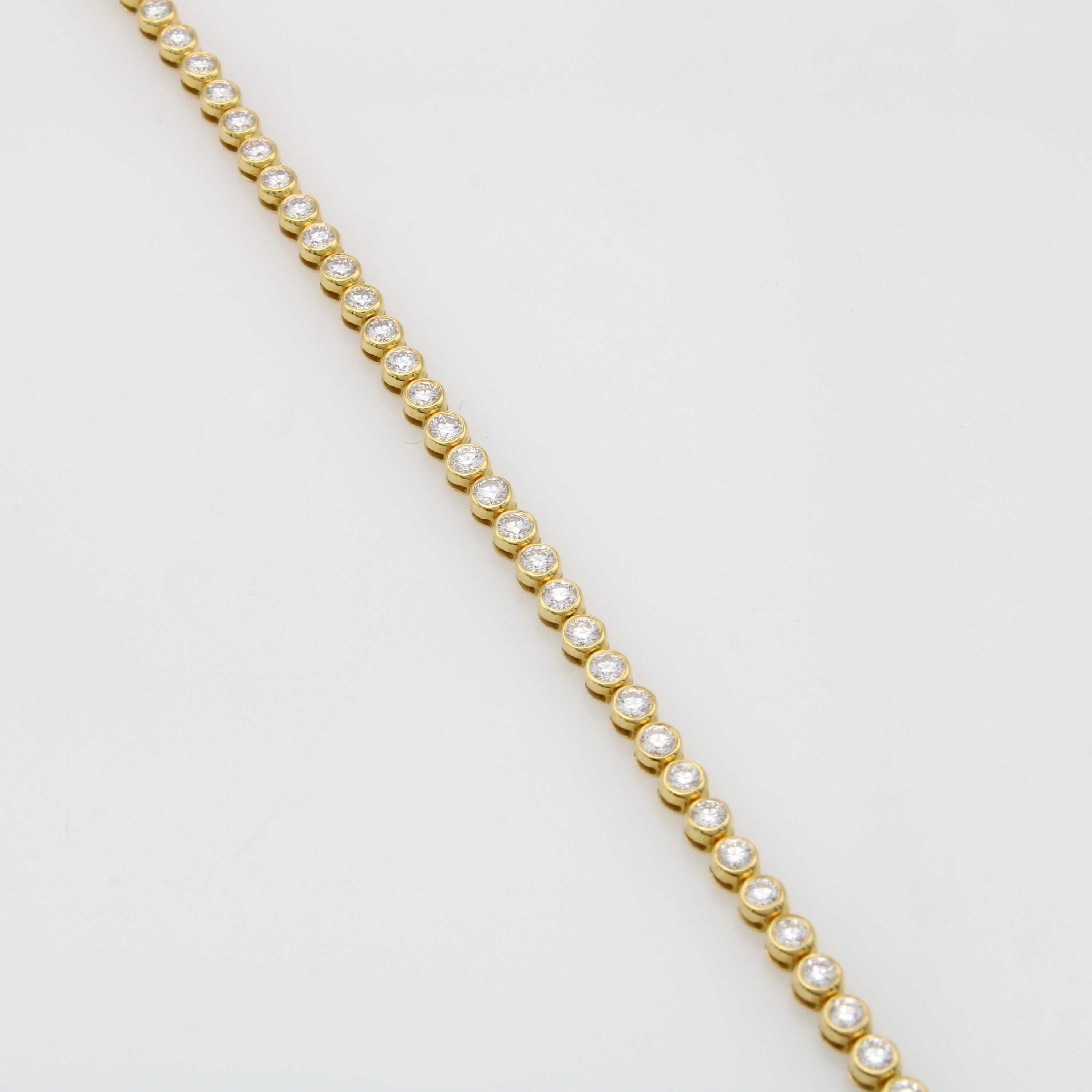Image 27097279 - Tennisarmband mit Brillanten, GG 750/000, 46 Brill. in schmalen Zargenf. zus. ca. 3 ct ...