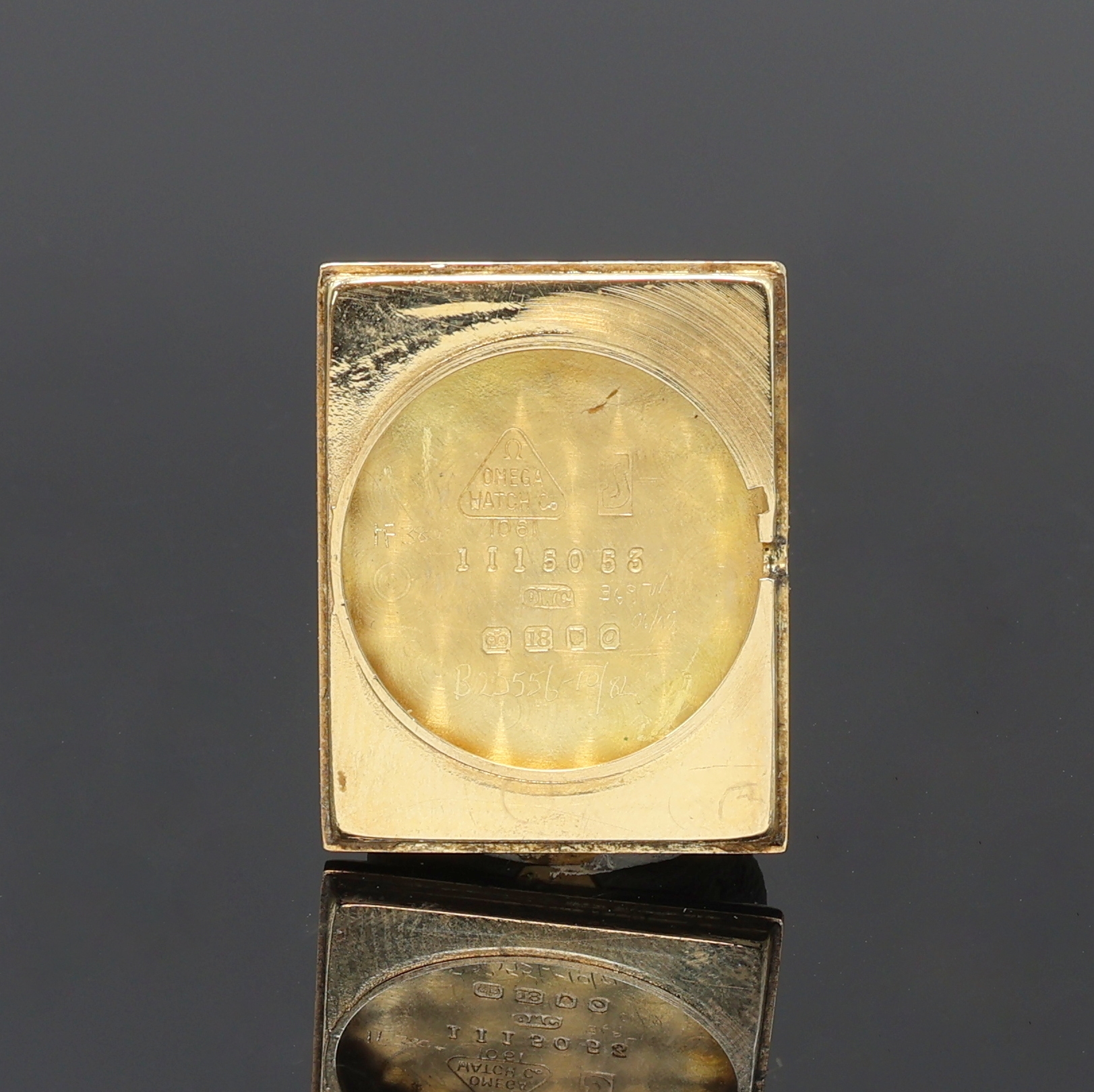 Detail e: OMEGA De Ville Armbanduhr in GG 750/000, Schweiz um 1969, Handaufzug, Boden aufgedr., silb. Zifferbl. pat./fl., gold. Std.-Ind. (fehl. b. 12), ...