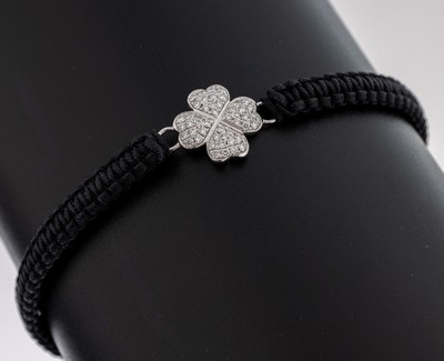 Image Cloth-bracelet with 14 kt gold brilliant- element , WG 585/000, black braided cloth ...