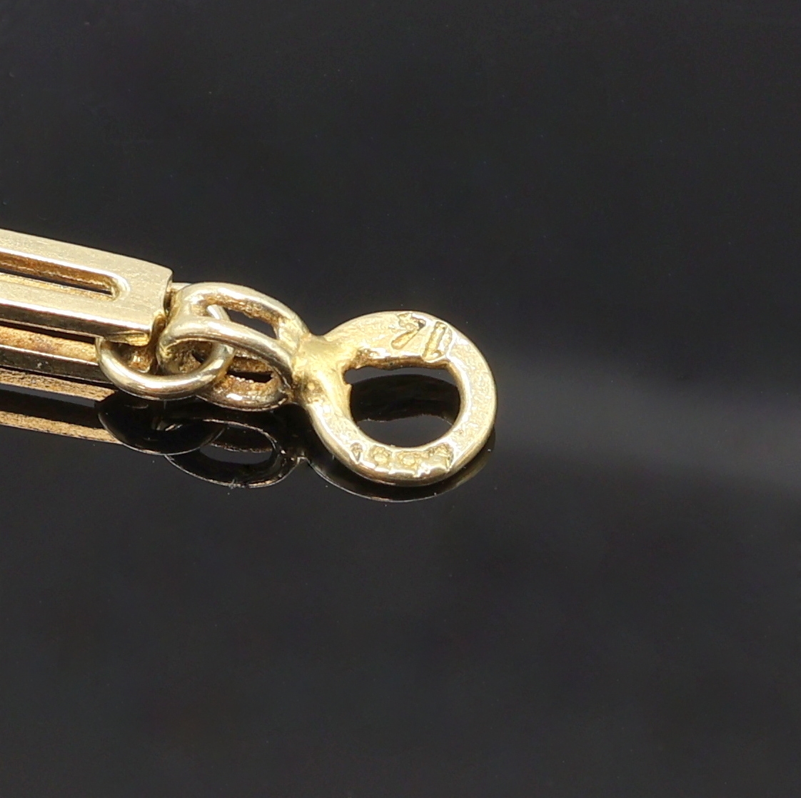 Detail b: Taschenuhrkette in GG 585/000, Karabinerverschluss, L. ca. 48,5 cm, Gew. ca. 20g, in gebrauchsfähigem Zustand