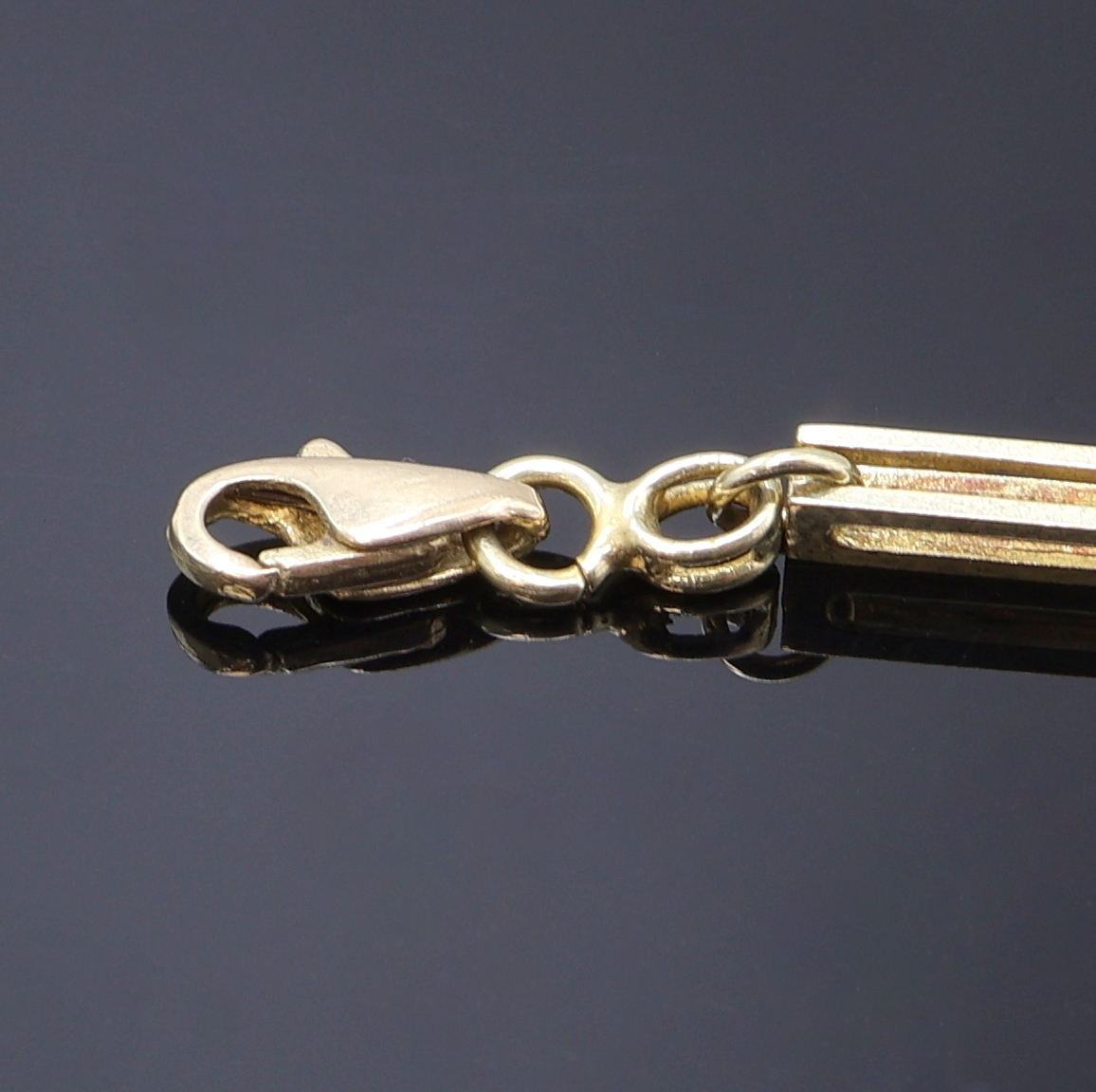 Detail c: Taschenuhrkette in GG 585/000, Karabinerverschluss, L. ca. 48,5 cm, Gew. ca. 20g, in gebrauchsfähigem Zustand