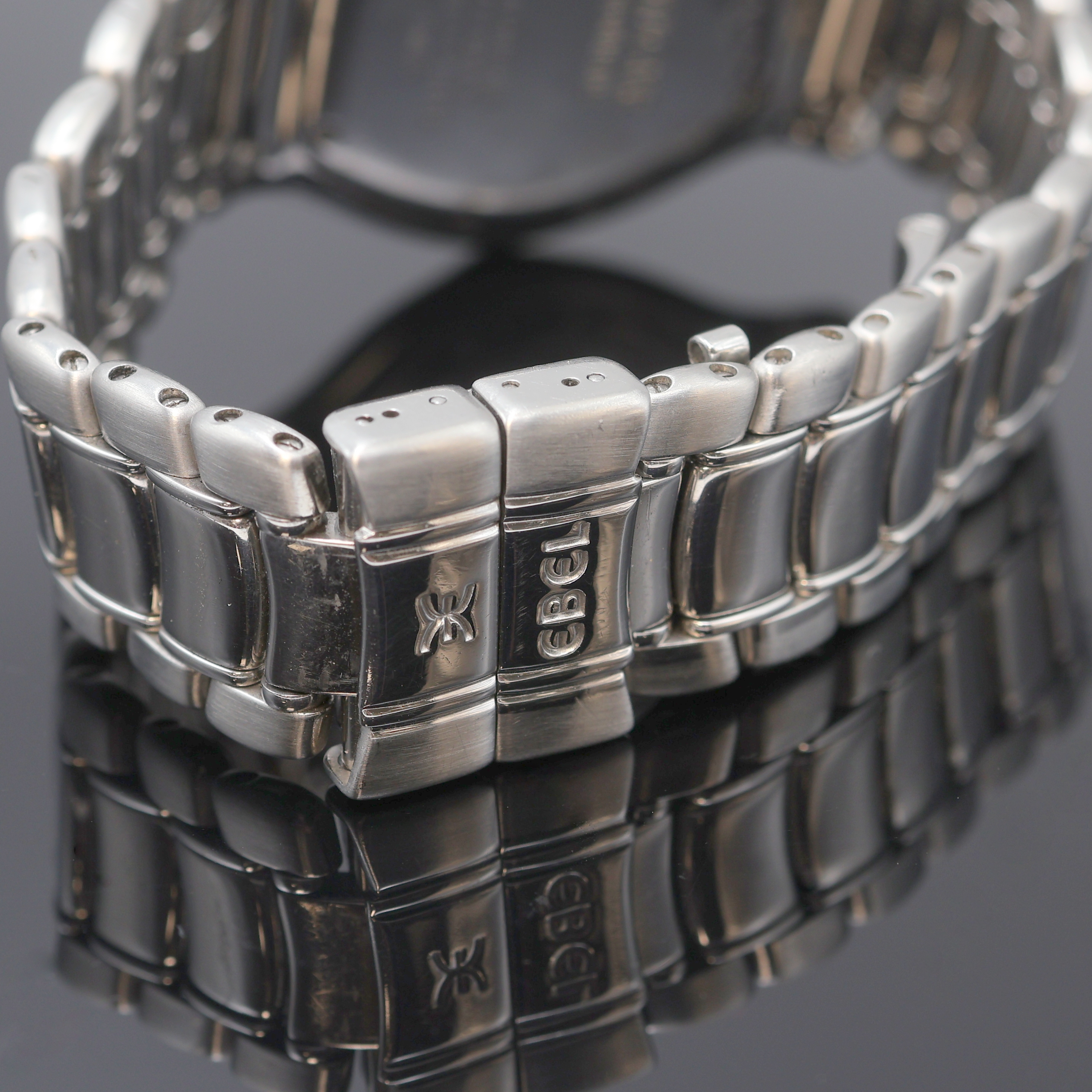 Detail c: EBEL Voyager Herrenarmbanduhr mit Weltanzeige Referenz 9124913, Schweiz um 1995, Automatik, Edelstahlgeh. inkl. orig. Gliederband m. Faltschl., Boden ...