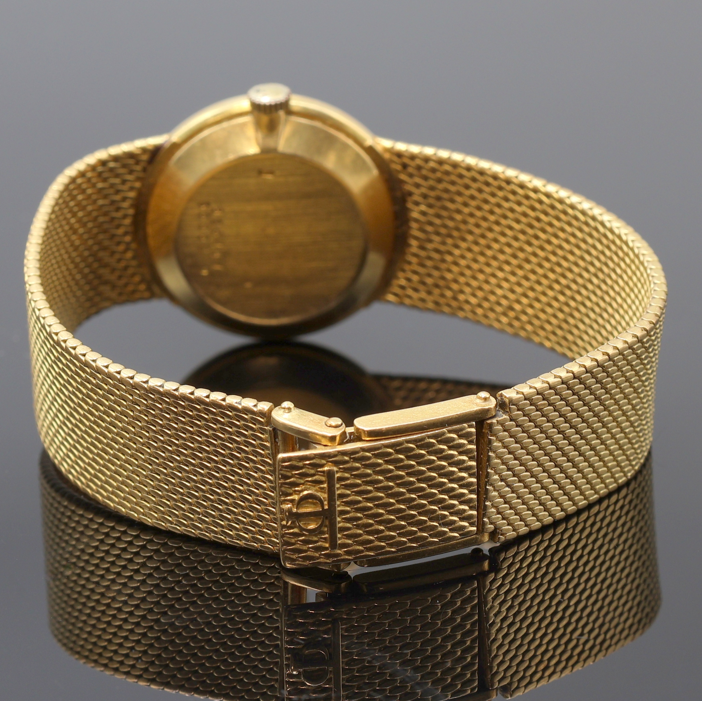 Detail b: BAUME & MERCIER Damenarmbanduhr in GG 750/000, Schweiz um 1970, Handaufzug, orig. Goldband, Boden aufgedr., champagnerfarb. Zifferbl. pat./fl., gold. ...