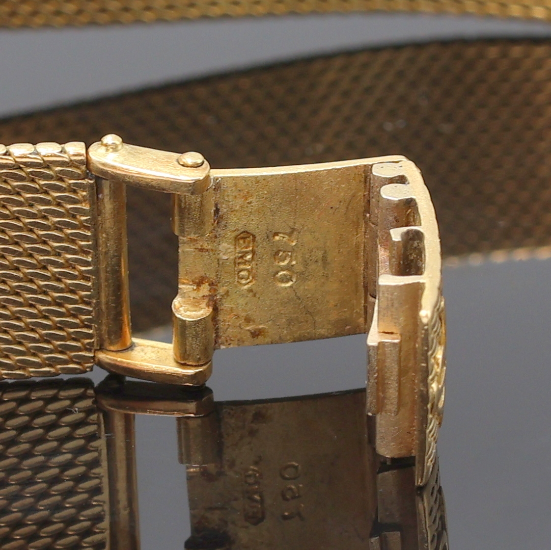 Detail c: BAUME & MERCIER Damenarmbanduhr in GG 750/000, Schweiz um 1970, Handaufzug, orig. Goldband, Boden aufgedr., champagnerfarb. Zifferbl. pat./fl., gold. ...