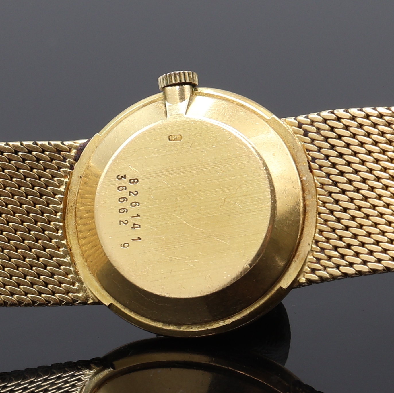 Detail e: BAUME & MERCIER Damenarmbanduhr in GG 750/000, Schweiz um 1970, Handaufzug, orig. Goldband, Boden aufgedr., champagnerfarb. Zifferbl. pat./fl., gold. ...