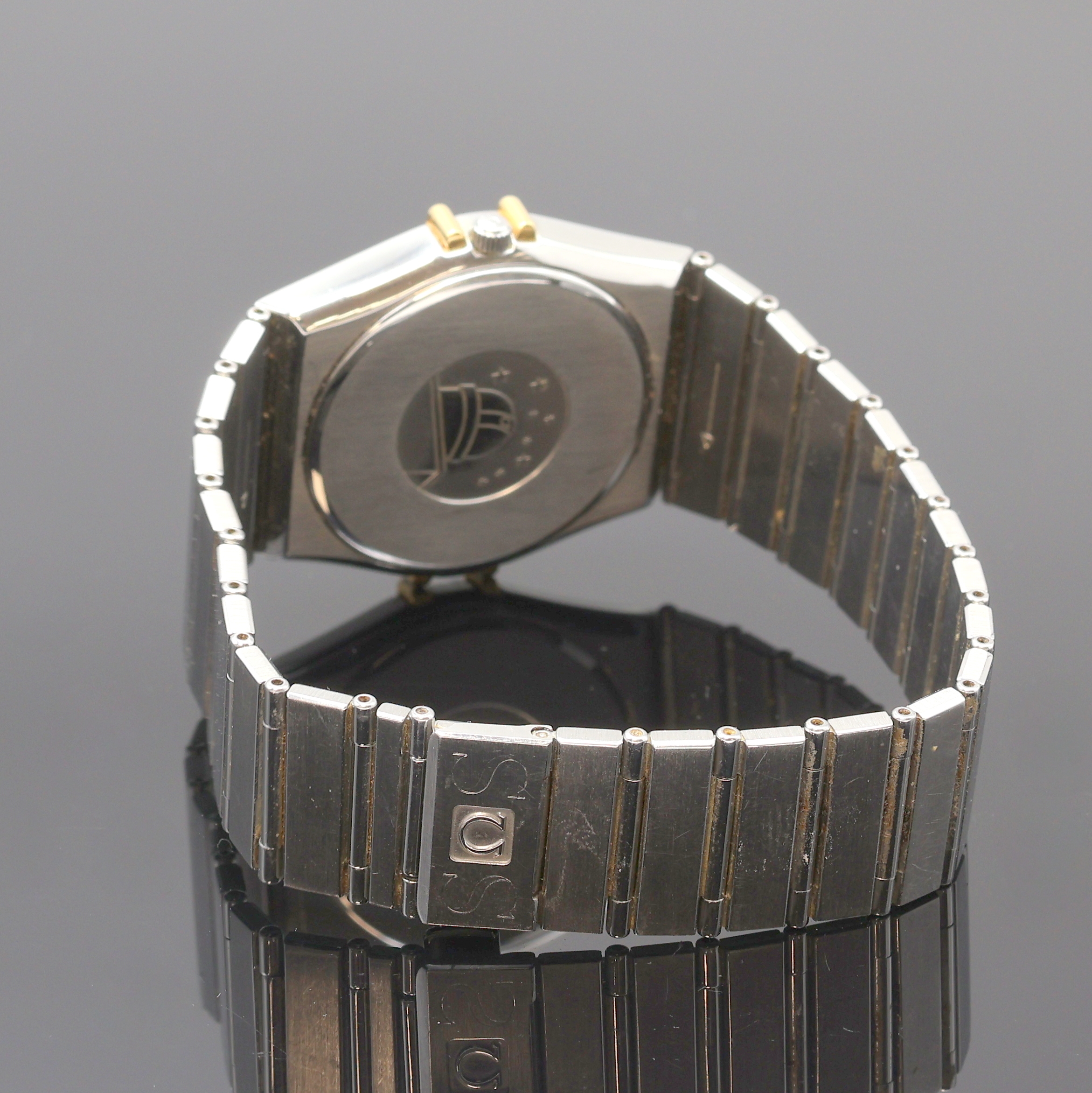 Detail b: OMEGA Herrenarmbanduhr Constellation Referenz 396.1070.1/396.1080.1, Schweiz um 1990, quarz, Edelstahl/Gold kombiniert inkl. Gliederband m. ...