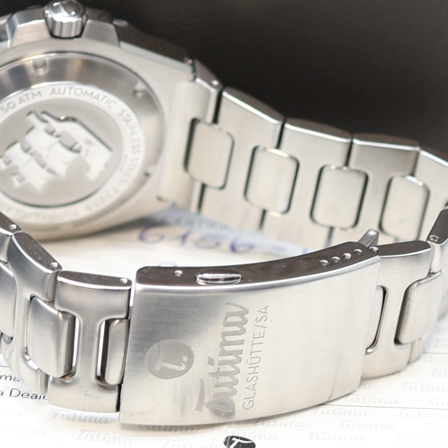 Detail b: TUTIMA M2 Seven Seas Herrenarmbanduhr Referenz 6156-06, Automatik, Edelstahlgeh. inkl. Gliederband m. Faltschl., Boden und Krone verschr., ab Herst. ...