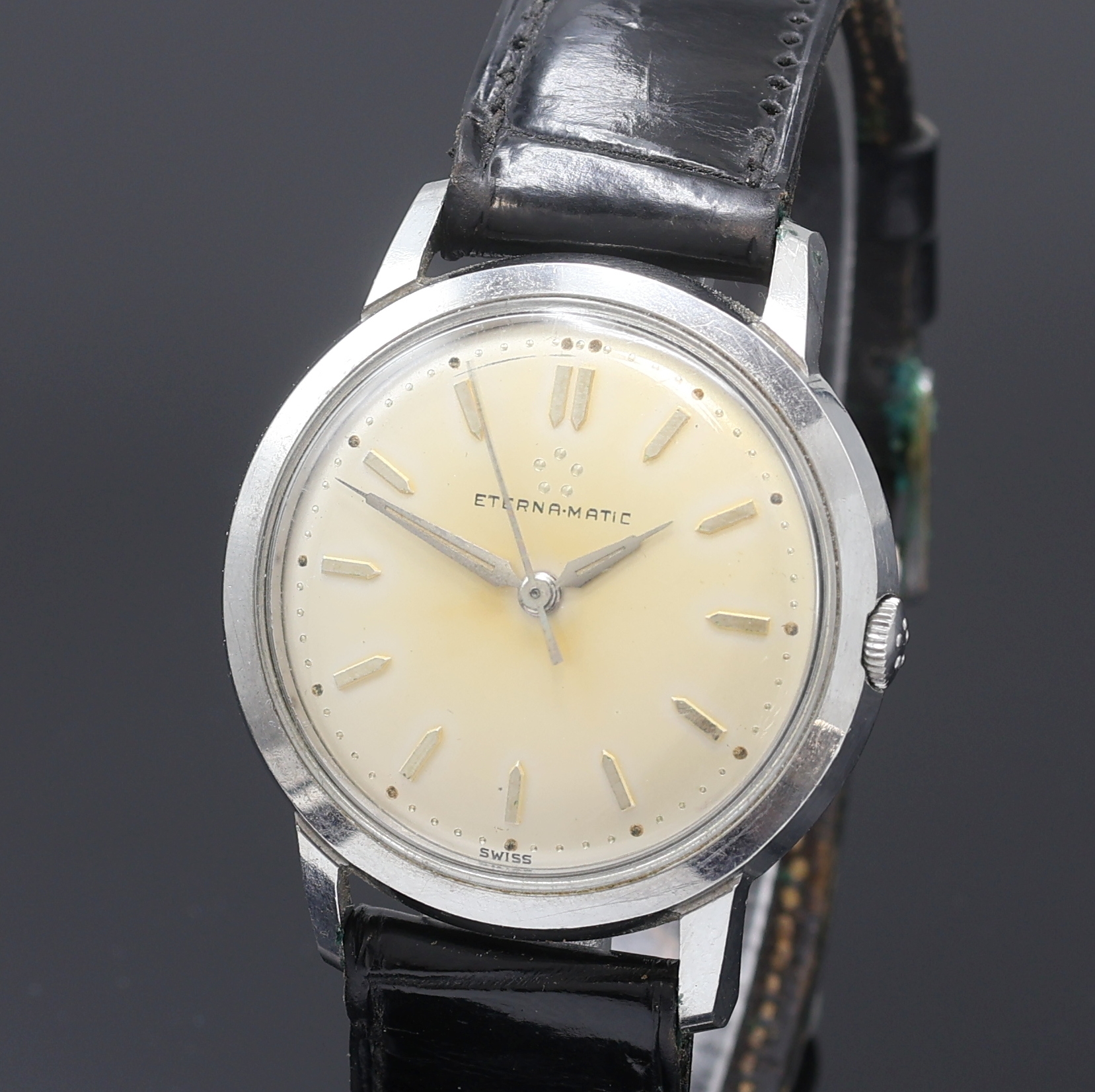 Detail a: ETERNA-MATIC Herrenarmbanduhr in Stahl, Schweiz um 1960, Automatik, Boden verschr., silb. Zifferbl. pat./fl., gold. Std.-Ind., silb. Leuchtzeiger, ...
